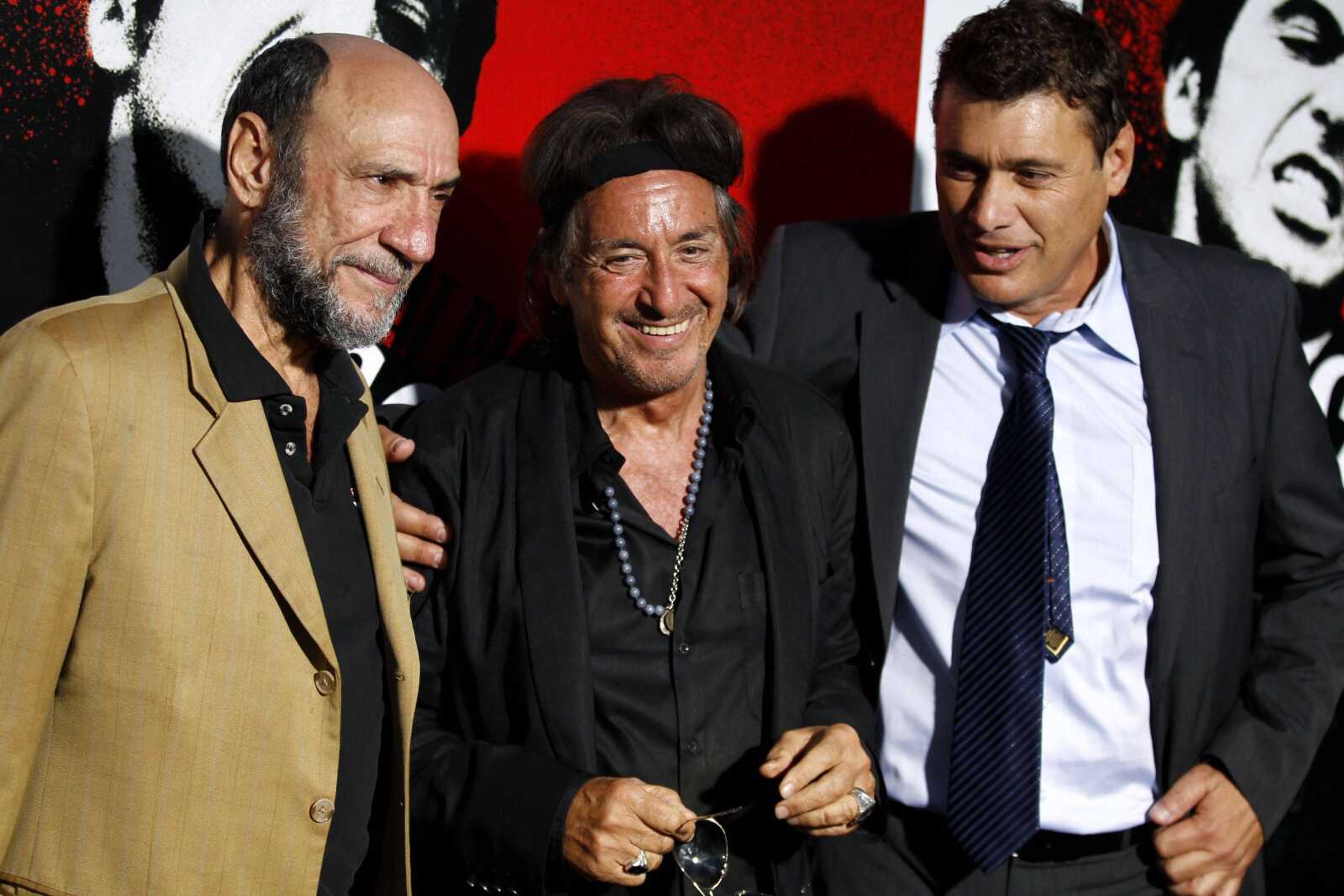 Actors Al Pacino, center, F. Murray Abraham, left, and Steven Bauer pose together Tuesday at an event celebrating the legacy of "Scarface" in Los Angeles. "Scarface" will be released on Blu-ray on Sept. 6. (Matt Sayles ~ Associated Press)