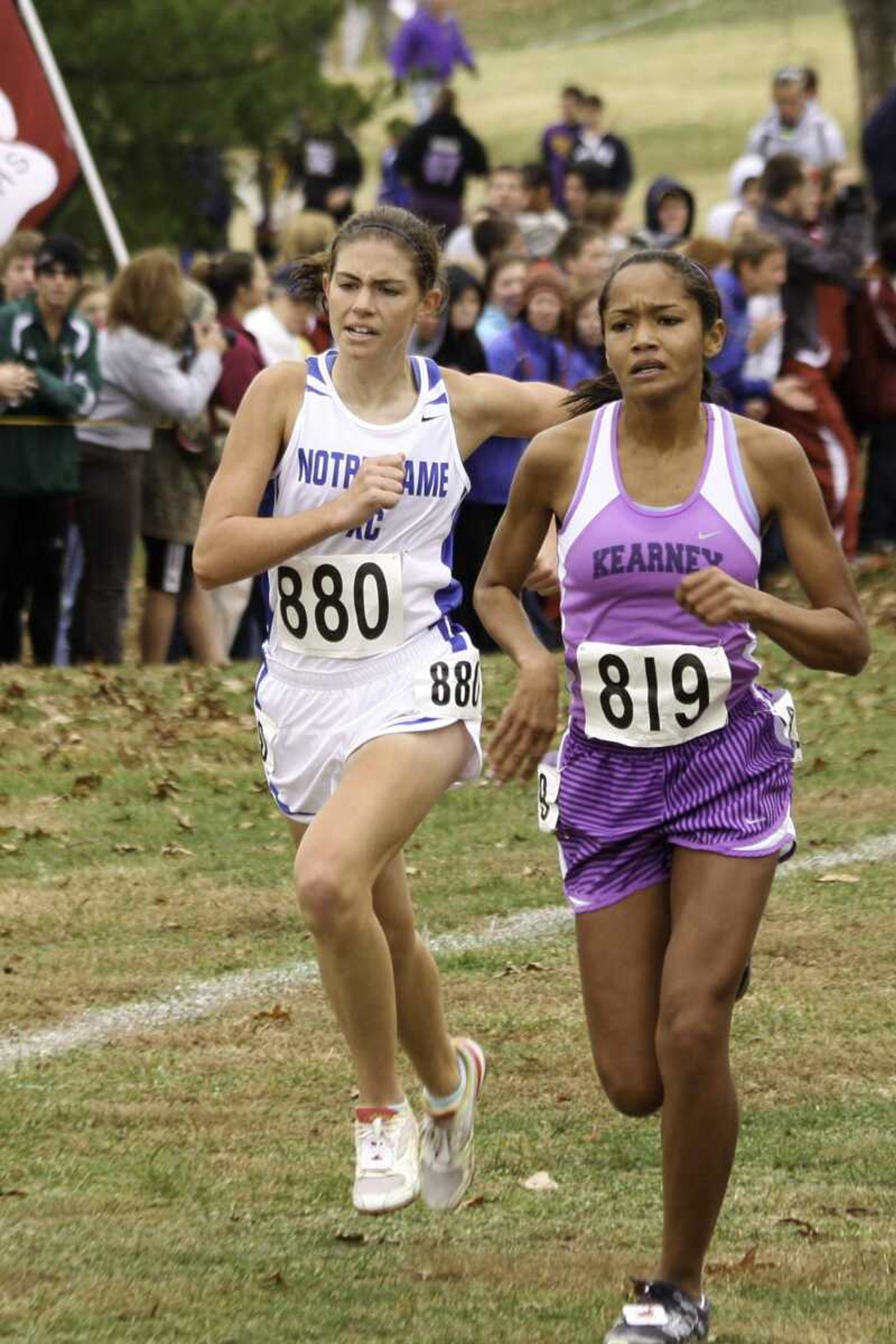 Notre Dame's Elizabeth Kiblinger battles Kearney's Jasmine Edwards for second place just before the finish line at the Class 3 state cross country meet Saturday in Jefferson City, Mo. (CHRIS AUCKLEY ~ Special to the Southeast Missourian)