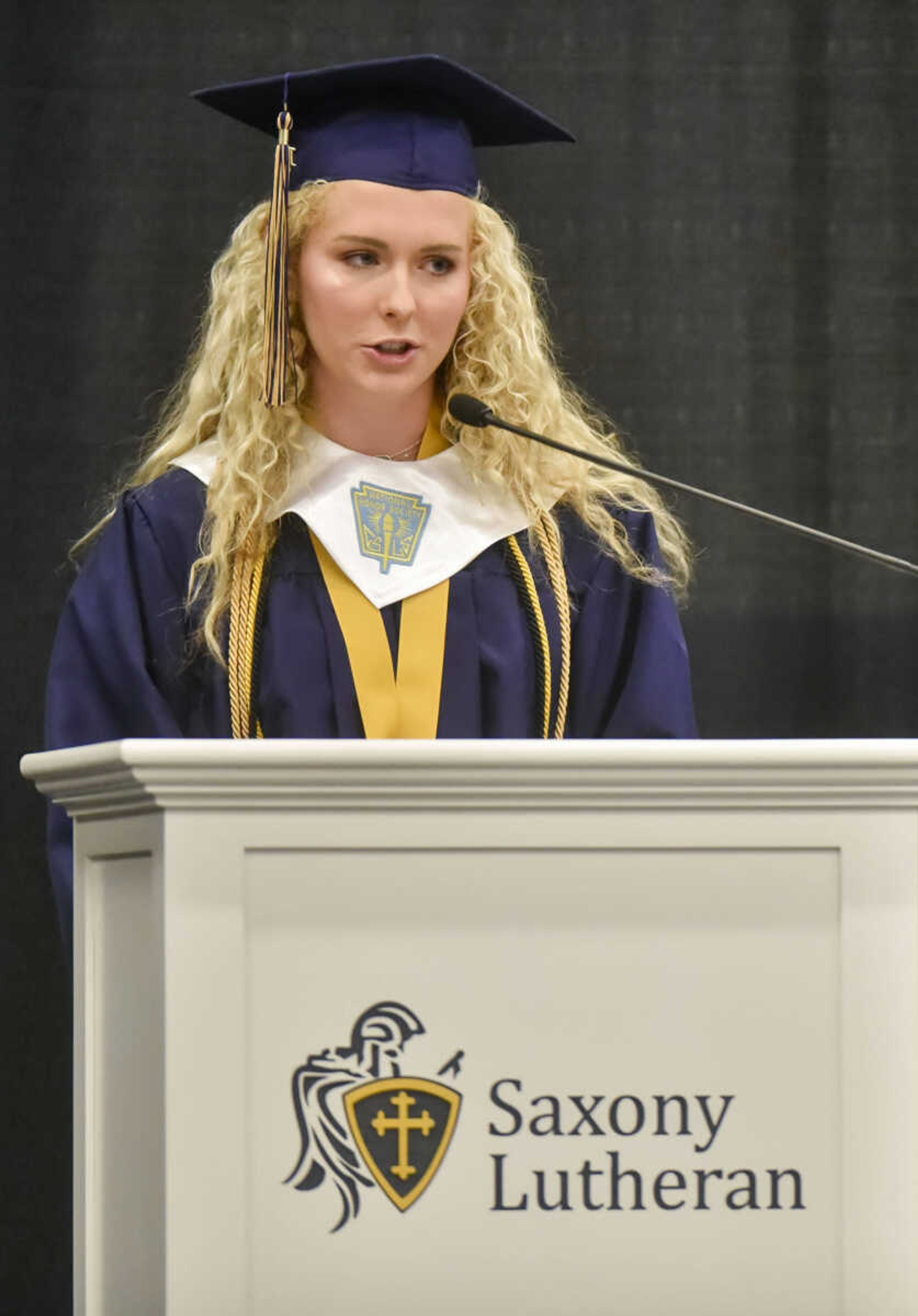 Senior class vice-president Allie Sprink introduces Laura Hayden to give the class commencement address Sunday, May 20, 2018 at Saxony Lutheran High School in Jackson.