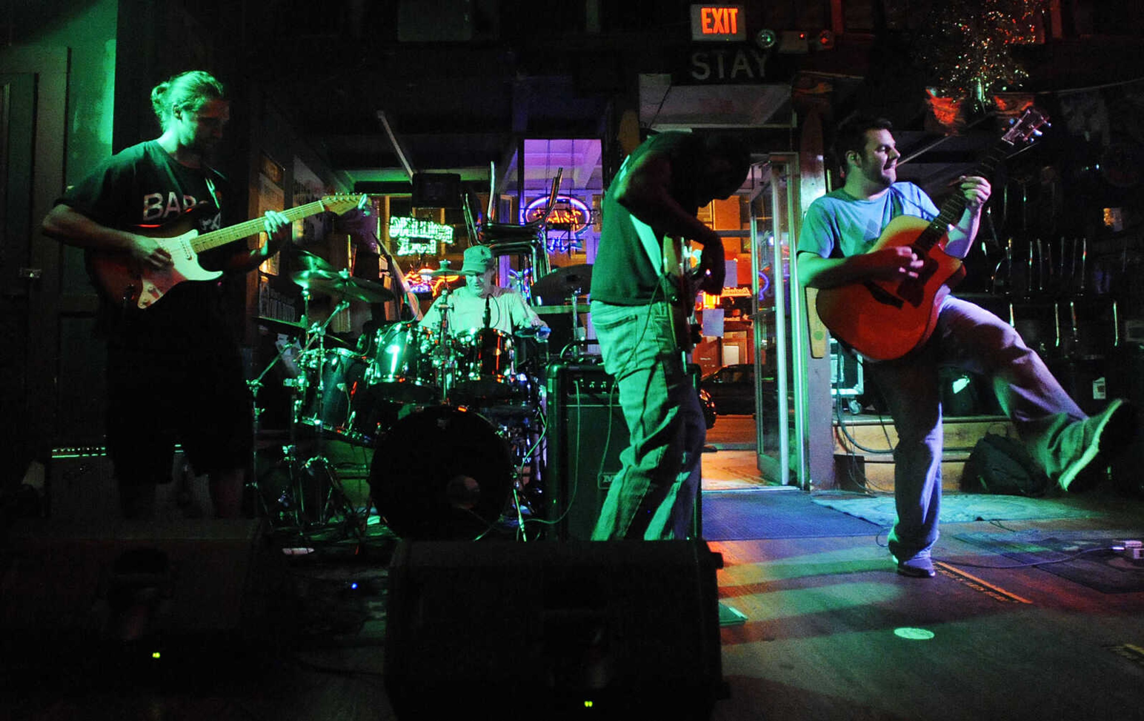 Mike Renick, right, Jamed Hams, Bryan West and Zach Priester play during a performance by the Mike Renick Band at the Rude Dog Pub, 123 Main Street, Friday, June 22.