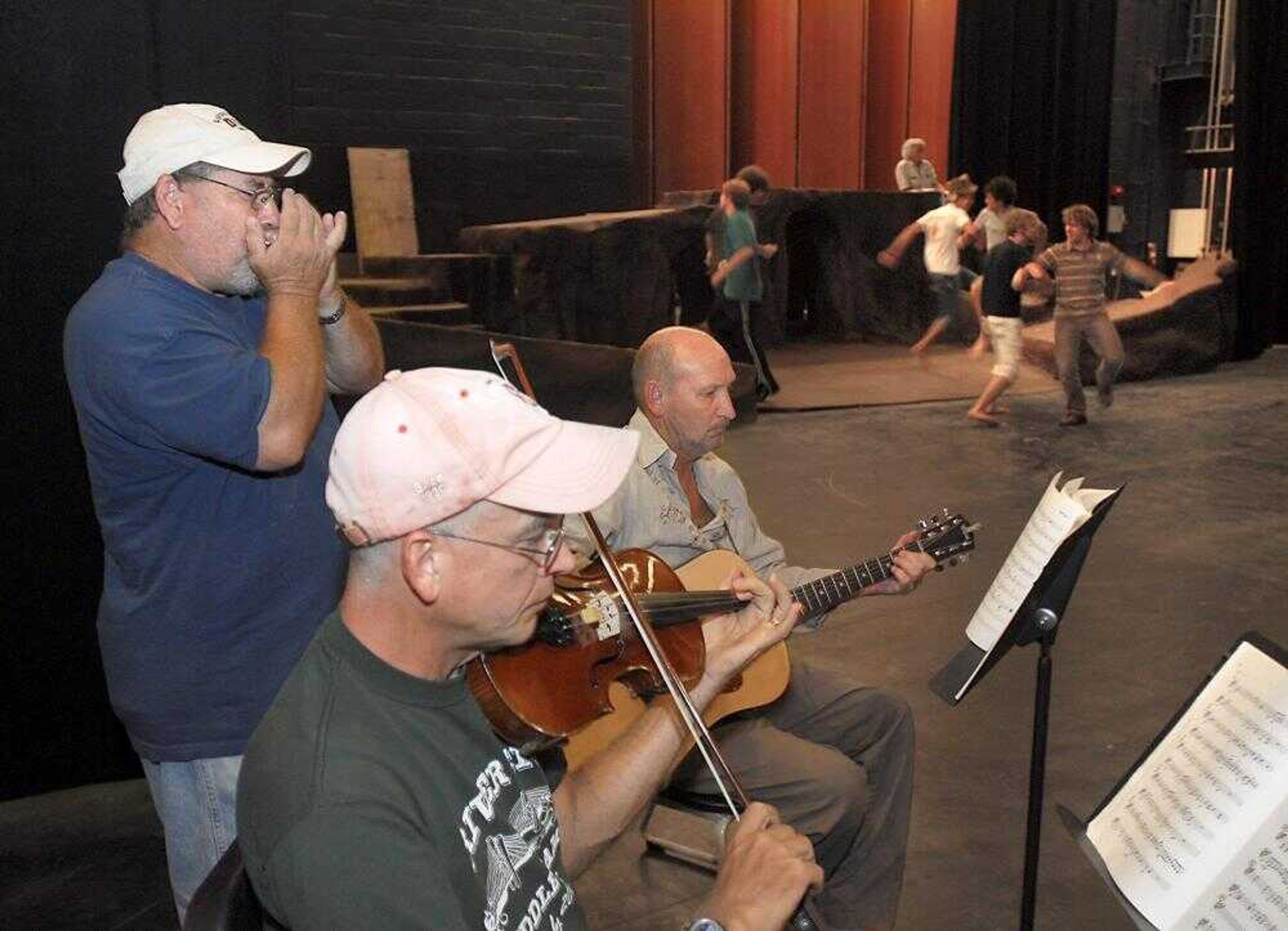 Local musicians, from left, Les Lindy Jr., Steve Schaffner and Bruce Zimmerman, rehearsed with the cast of "Big River" Tuesday night in the Bedell Performance Hall at the River Campus.<br>(Fred Lynch)