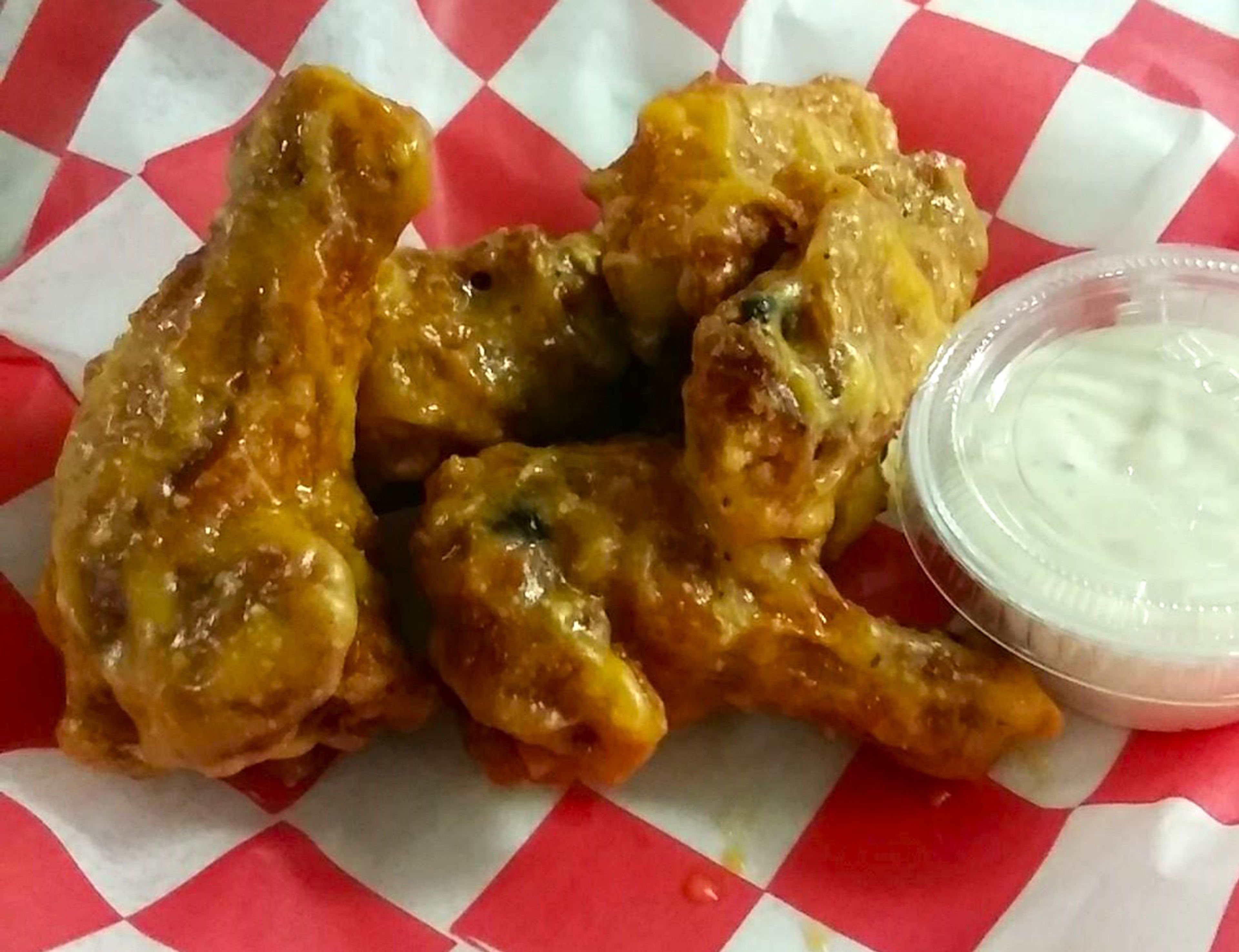 A sample of the West Park Lanes bone-in wings, juicy and crispy on the outside.