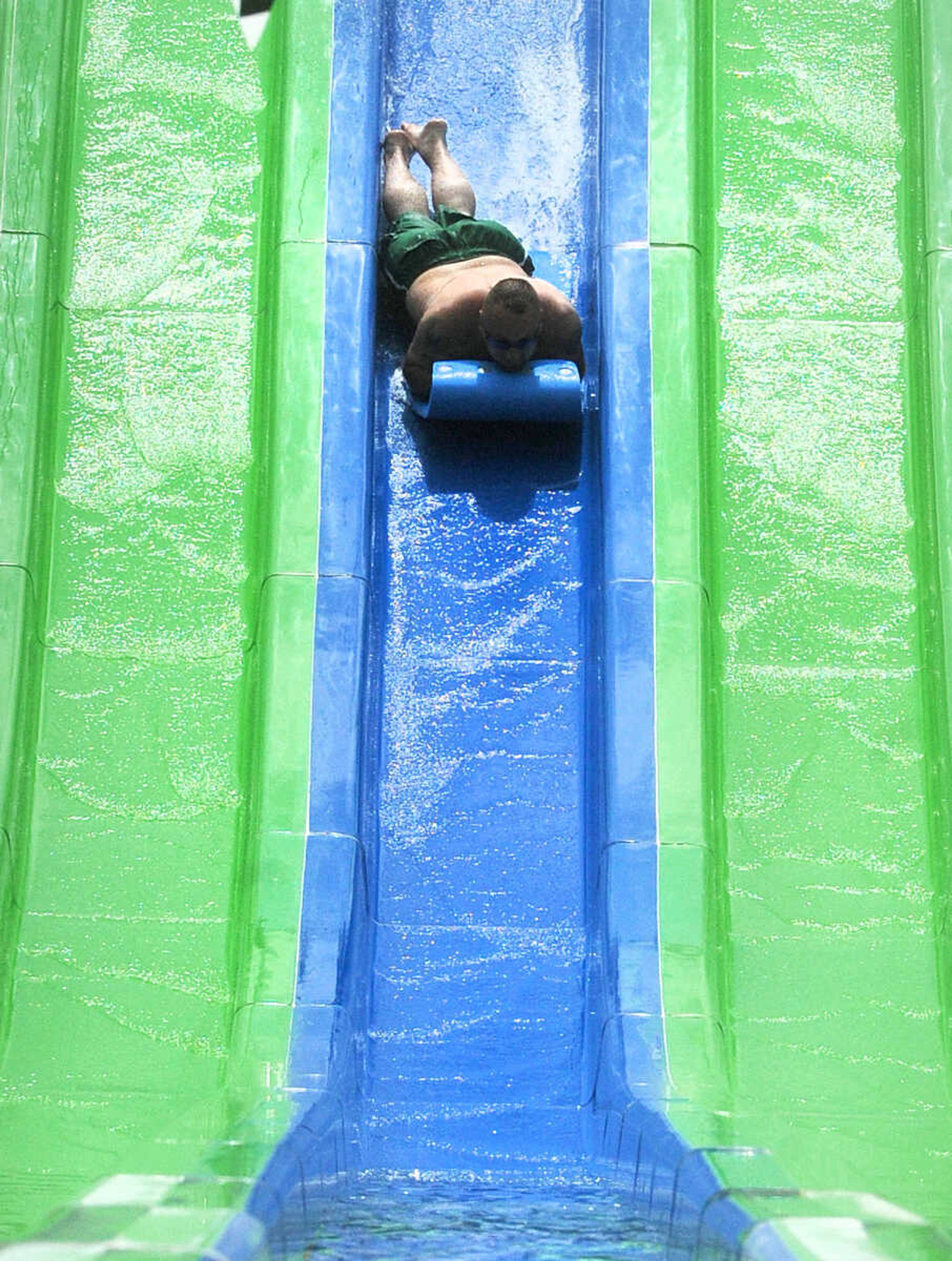 LAURA SIMON ~ lsimon@semissourian.com

The Cape Girardeau Parks and Recreation Department opened the new 265-foot-long free-fall slide, 259-foot-long triple-drop slide and a three-Lane 319-foot-long mat racer with 30-foot tower, at Cape Splash Family Aquatic Center, Thursday, July 9, 2015.