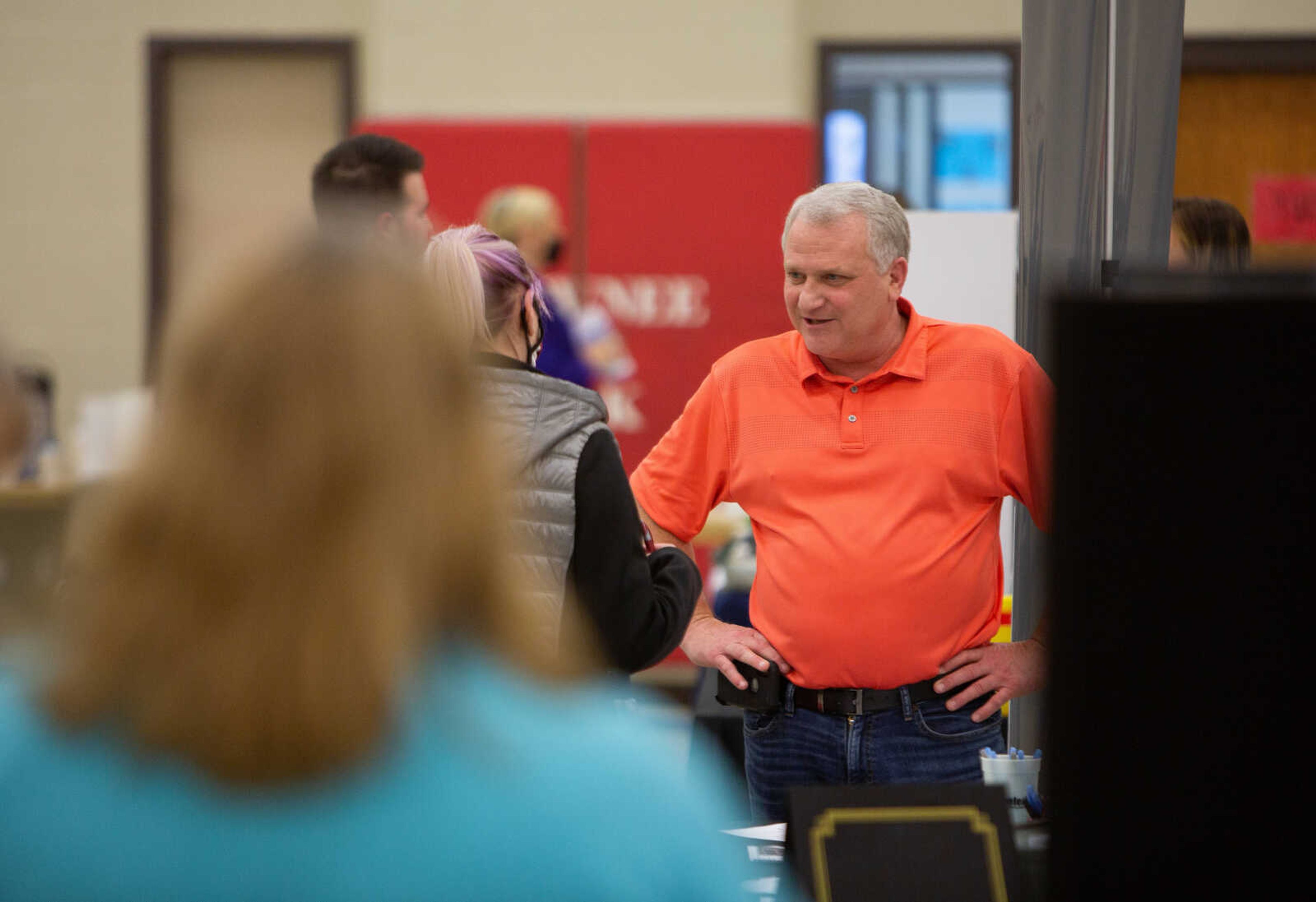 Randy Nielsen, president and CEO of Schaefer Electrical Enclosures, speaks with job seekers. Eighteen companies attended the event at the Shawnee Park Center on March 25, 2021.