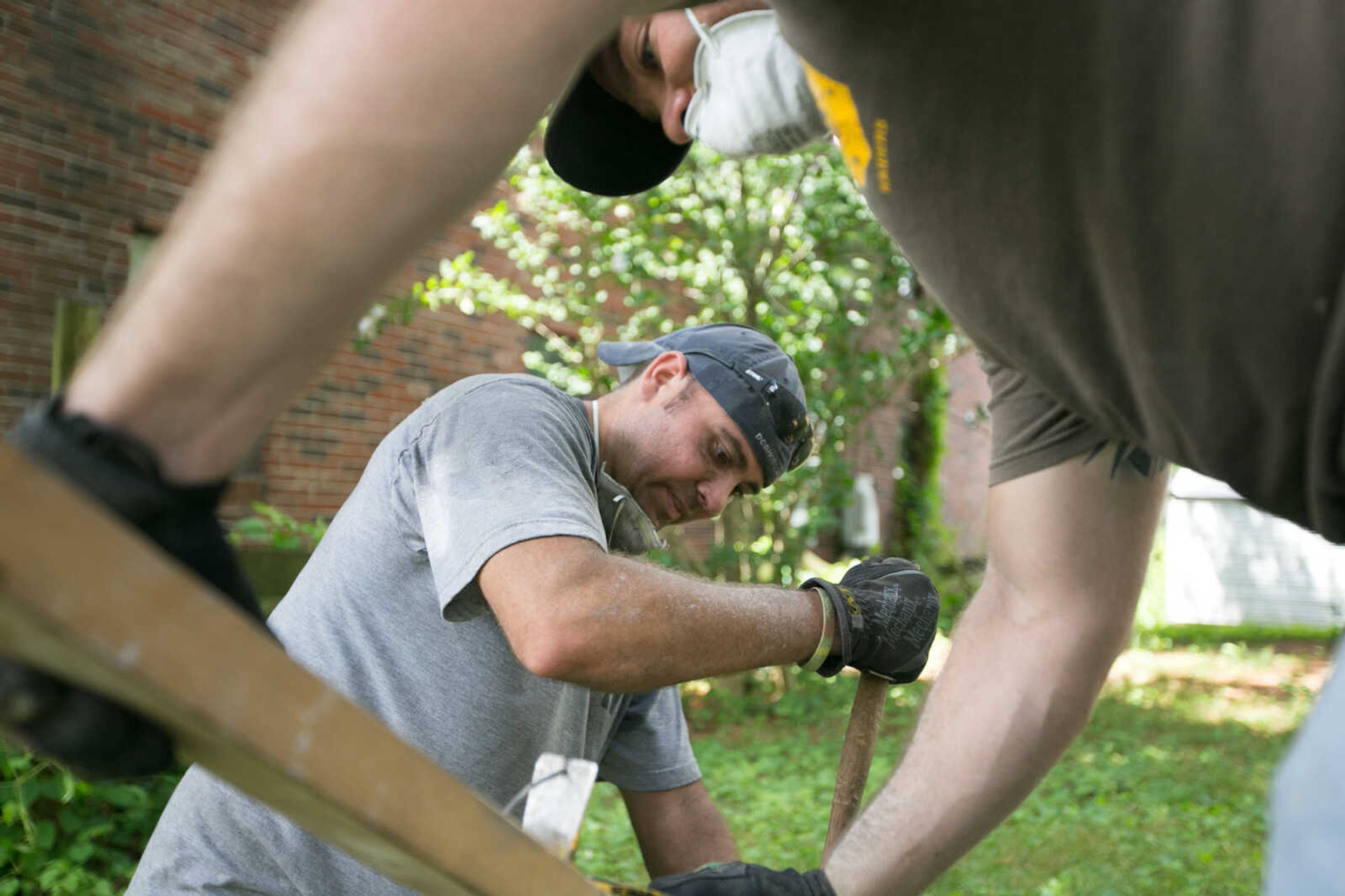 GLENN LANDBERG ~ glandberg@semissourian.com


Rocky Everett, center, and Jacob Fish pull nails from a board during a work day at a house donated to the Student Veterans Organization at Southeast Missouri State University, Saturday, June 20, 2015 in Cape Girardeau.