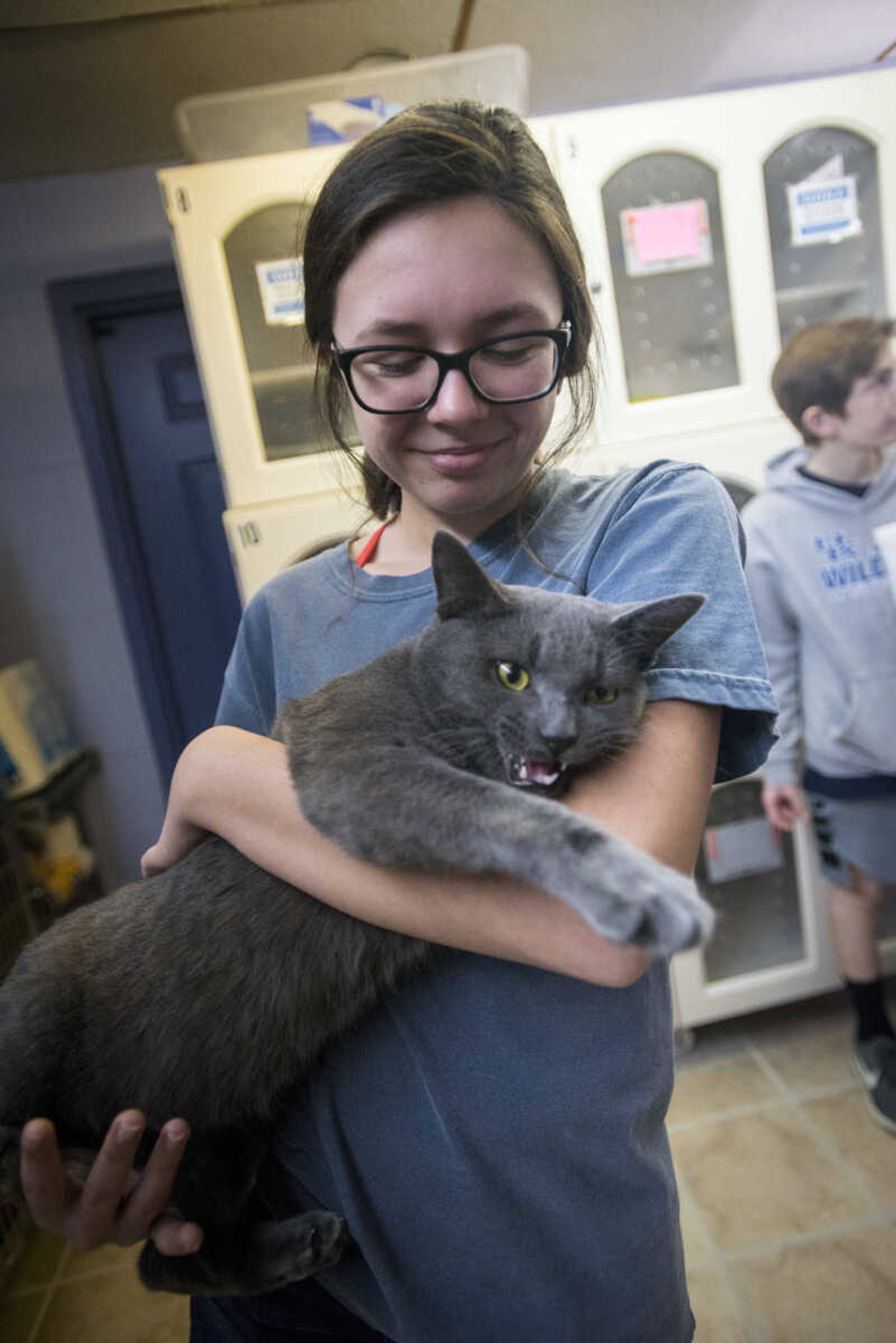 Gigi Merideth, 15, holds her adopted cat at the 40th anniversary of the Humane Society of Southeast Missouri Saturday, Dec. 16 , 2017 in Cape Girardeau.