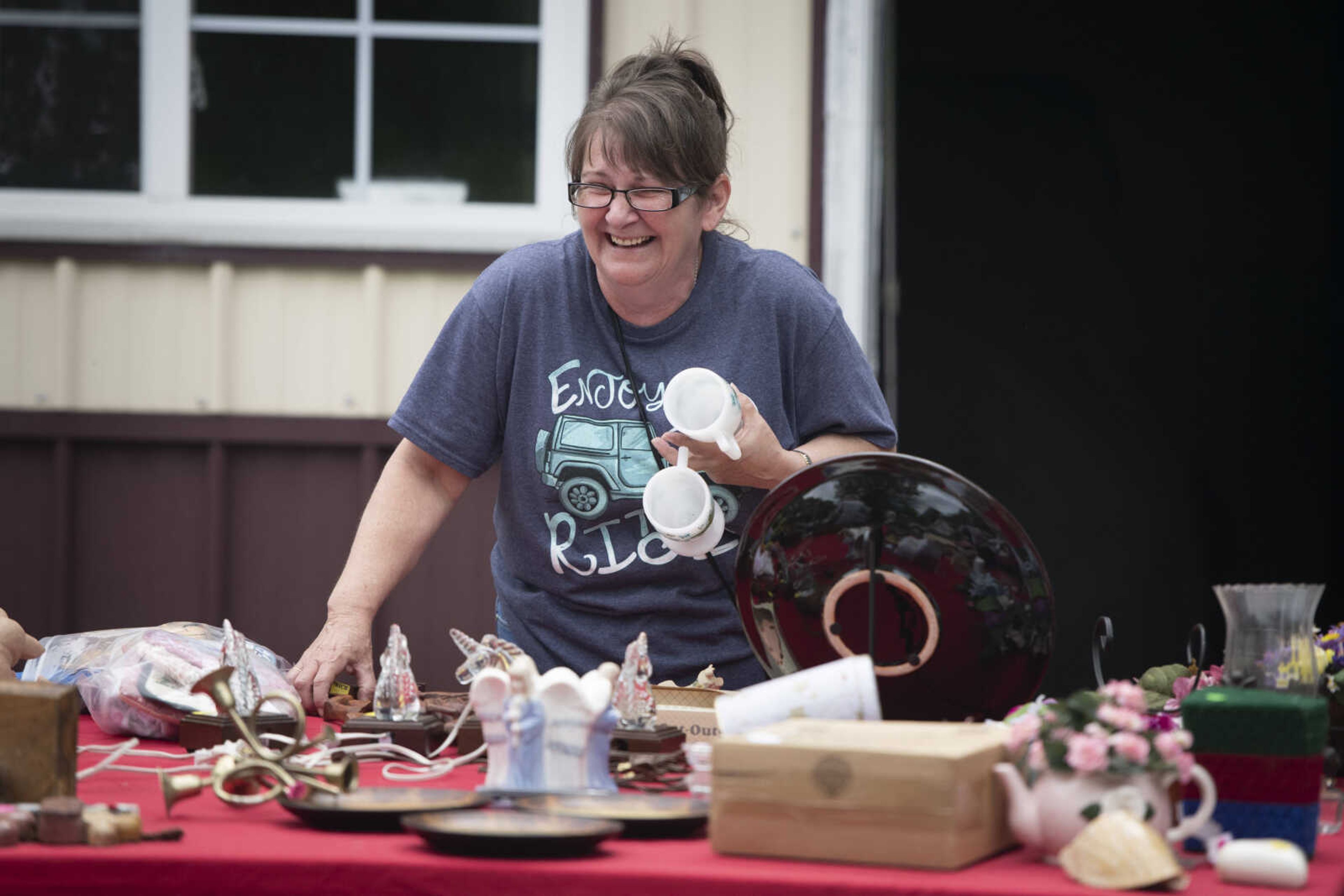 Reeta Gean of Alto Pass, Illinois, laughs while attending a sale between Jackson and Gordonville during the 100-Mile Yard Sale on Saturday, May 23, 2020, along Highway 25.&nbsp;