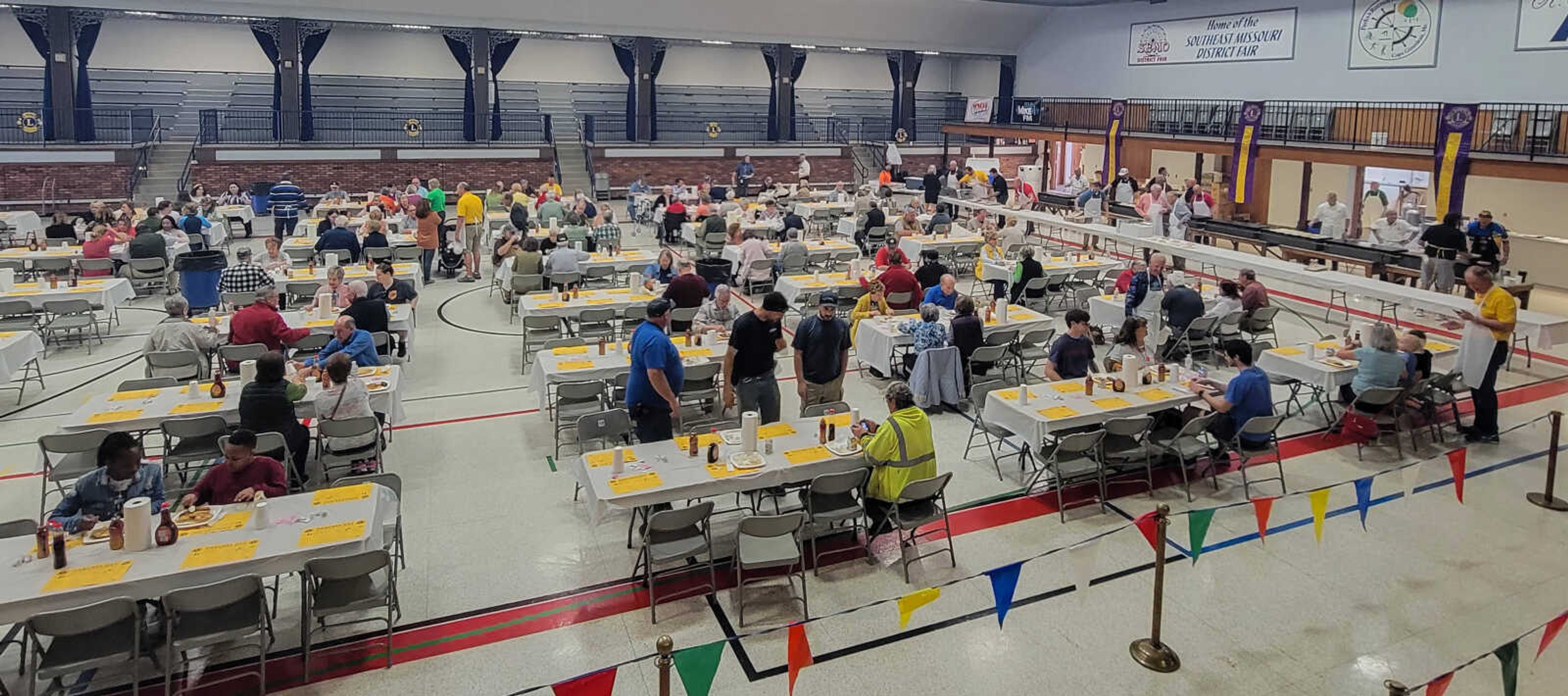 Customers sit and eat during the 84th annual Lions Club Pancake day.