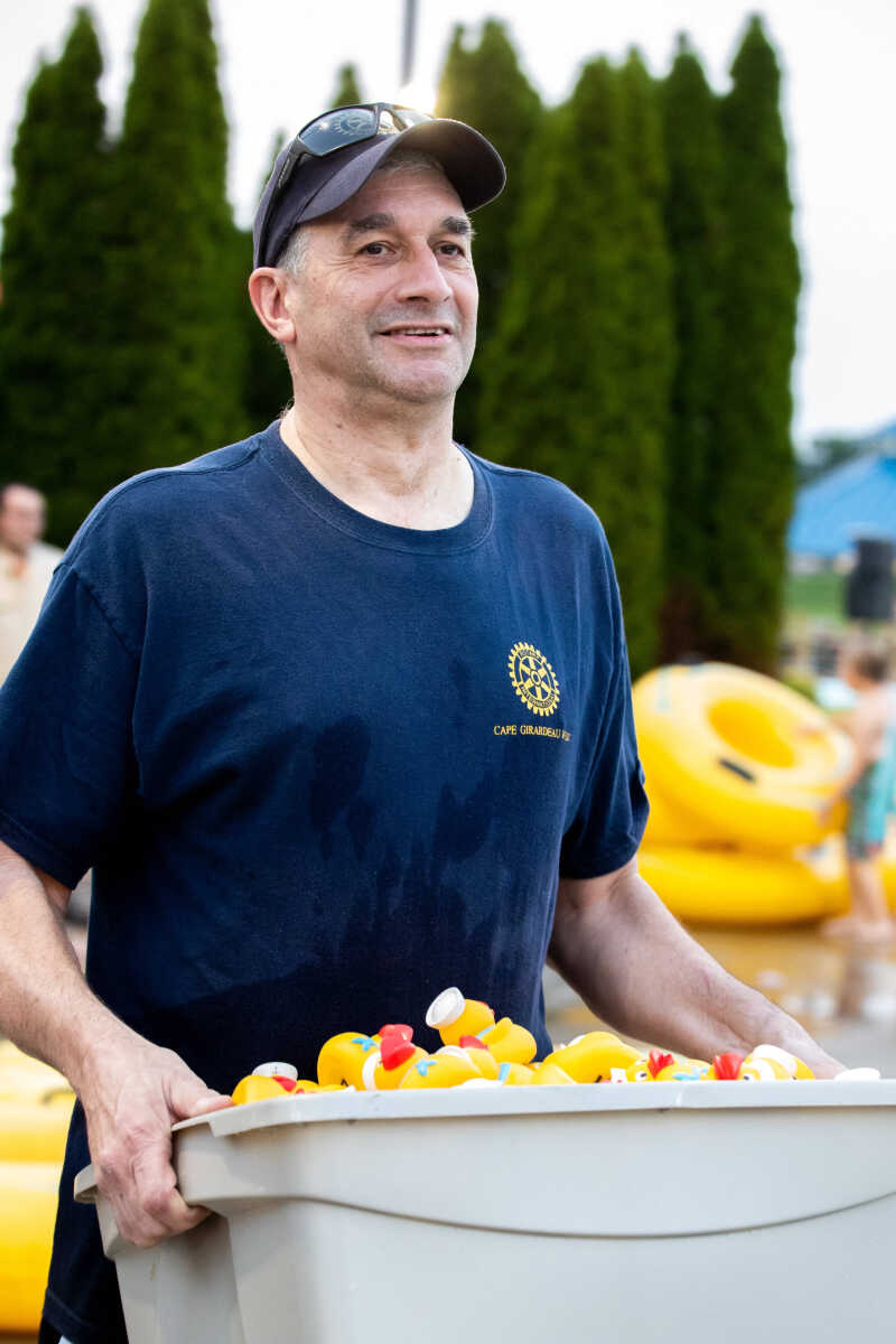 Scott McClanahan carries a bin of rubber ducks.