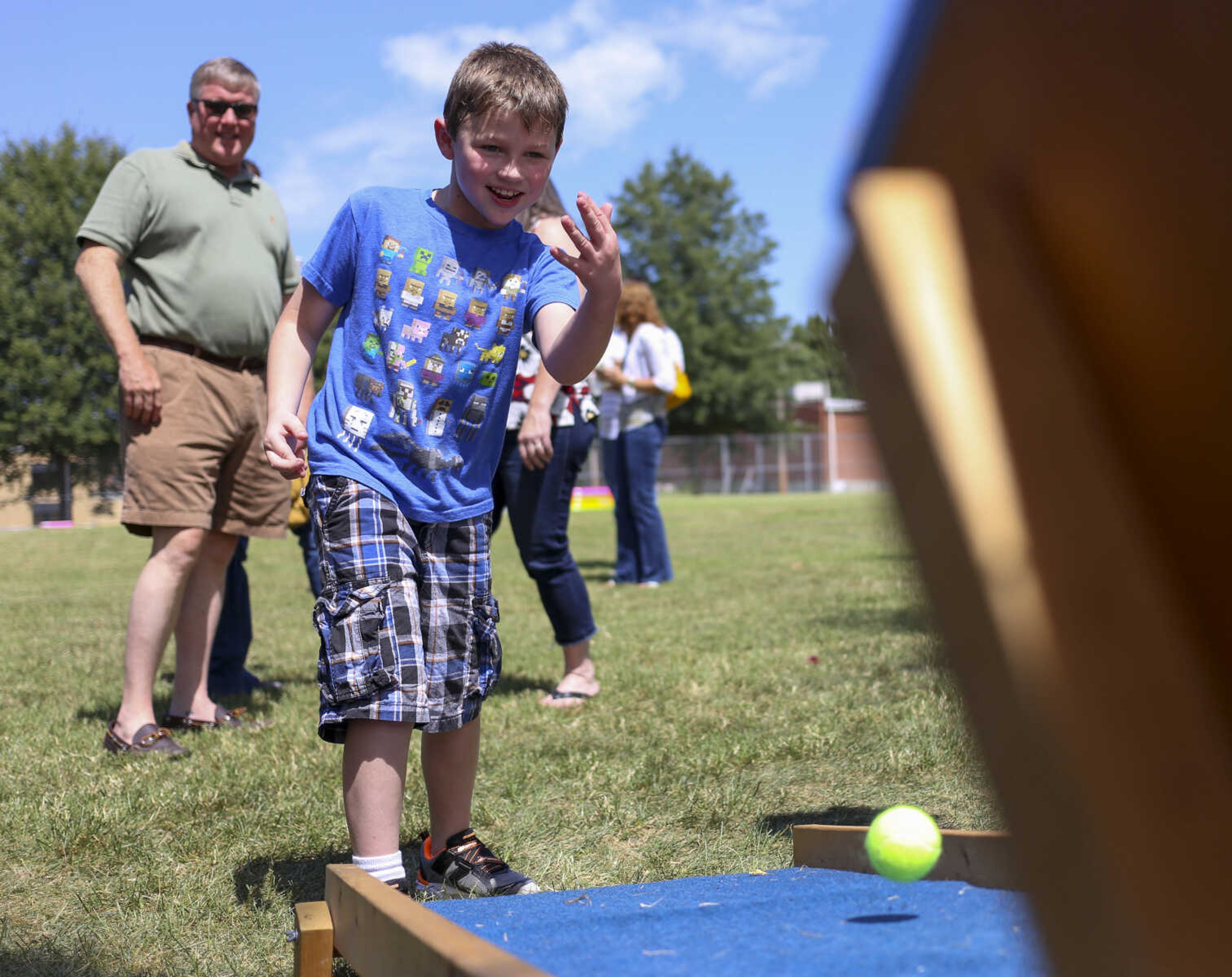 Declan Vowels plays a skee-ball game at the St. Mary Cathedral parish picnic on Sunday, August 27, 2017, in Cape Girardeau.