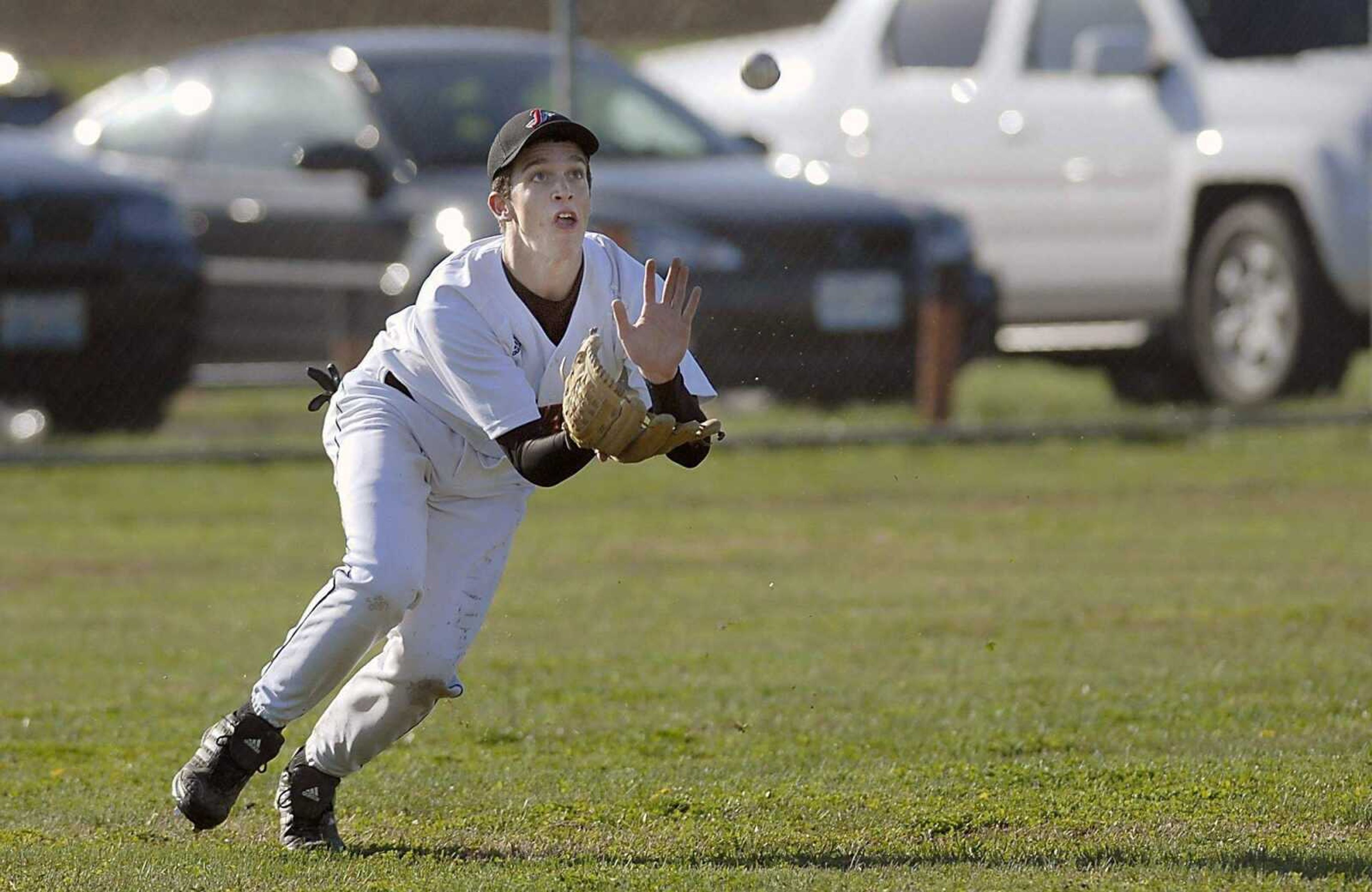 Jackson left fielder Zach McDowell makes a sliding catch.