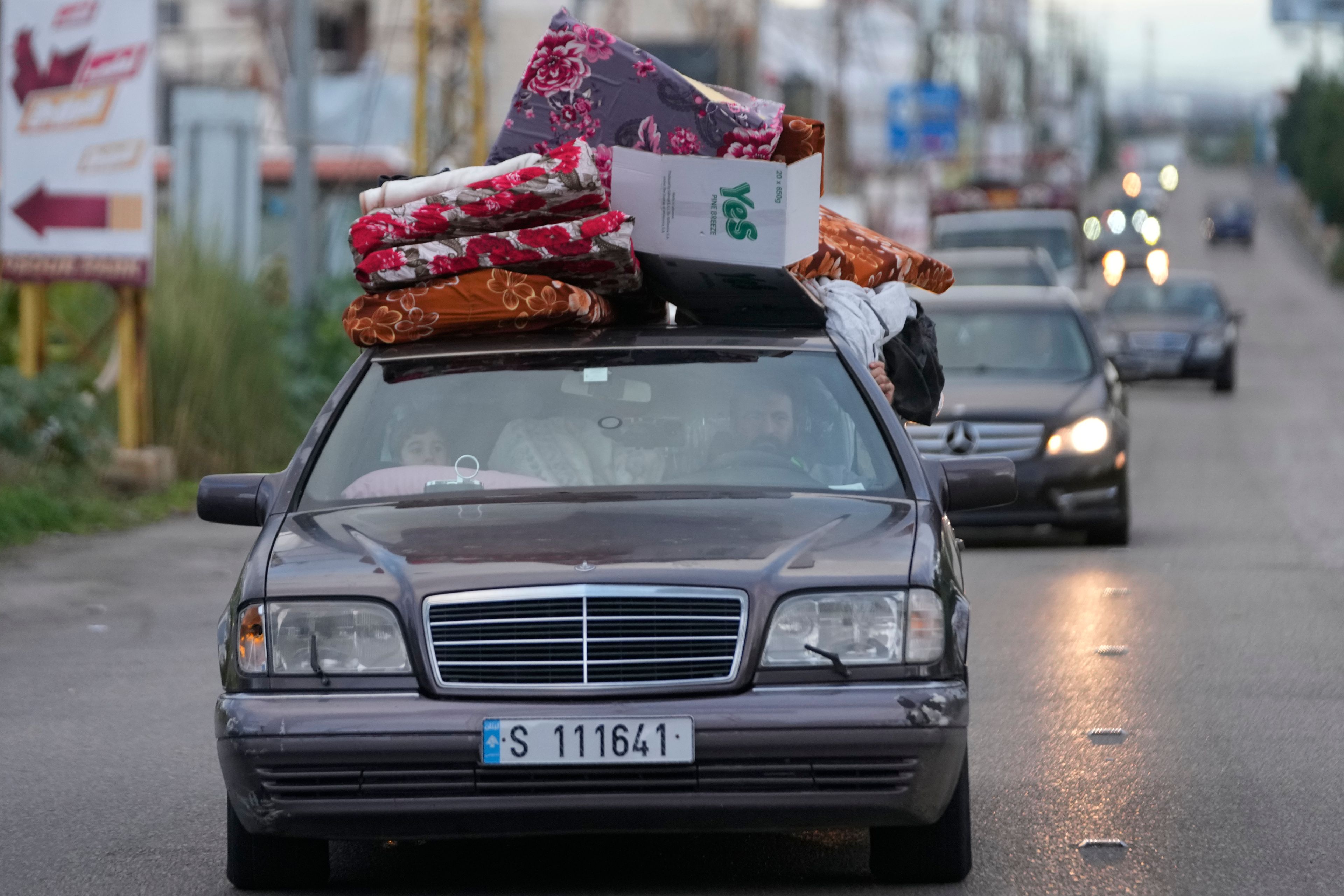 People in their cars with belongings return back to their villages after a ceasefire between Hezbollah and Israel began early morning, in Tyre, south Lebanon, Wednesday, Nov. 27, 2024. (AP Photo/Hussein Malla)