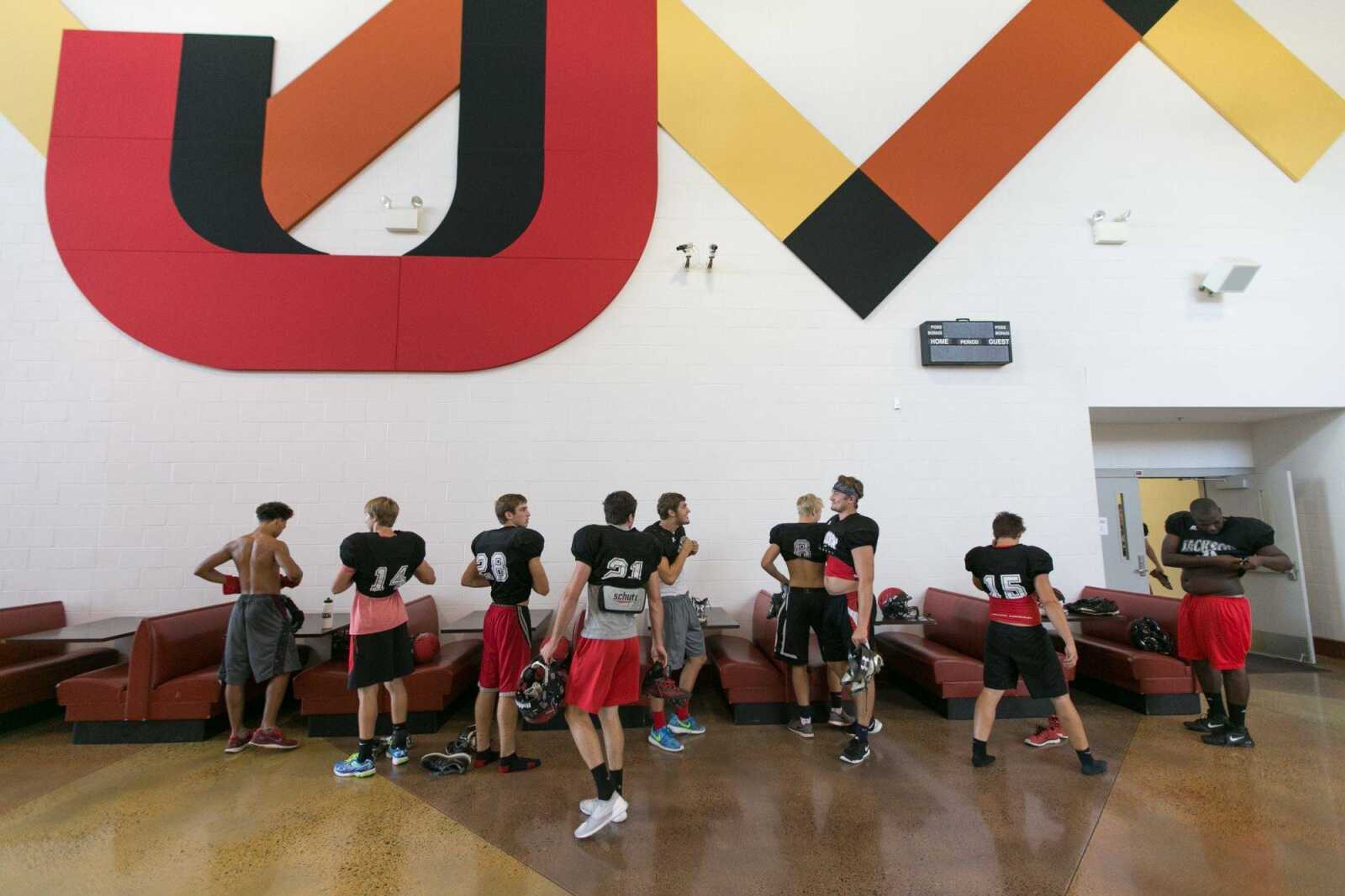 Jackson players suit up for practice Tuesday, Aug. 11, 2015 at Jackson High School. (Glenn Landberg)