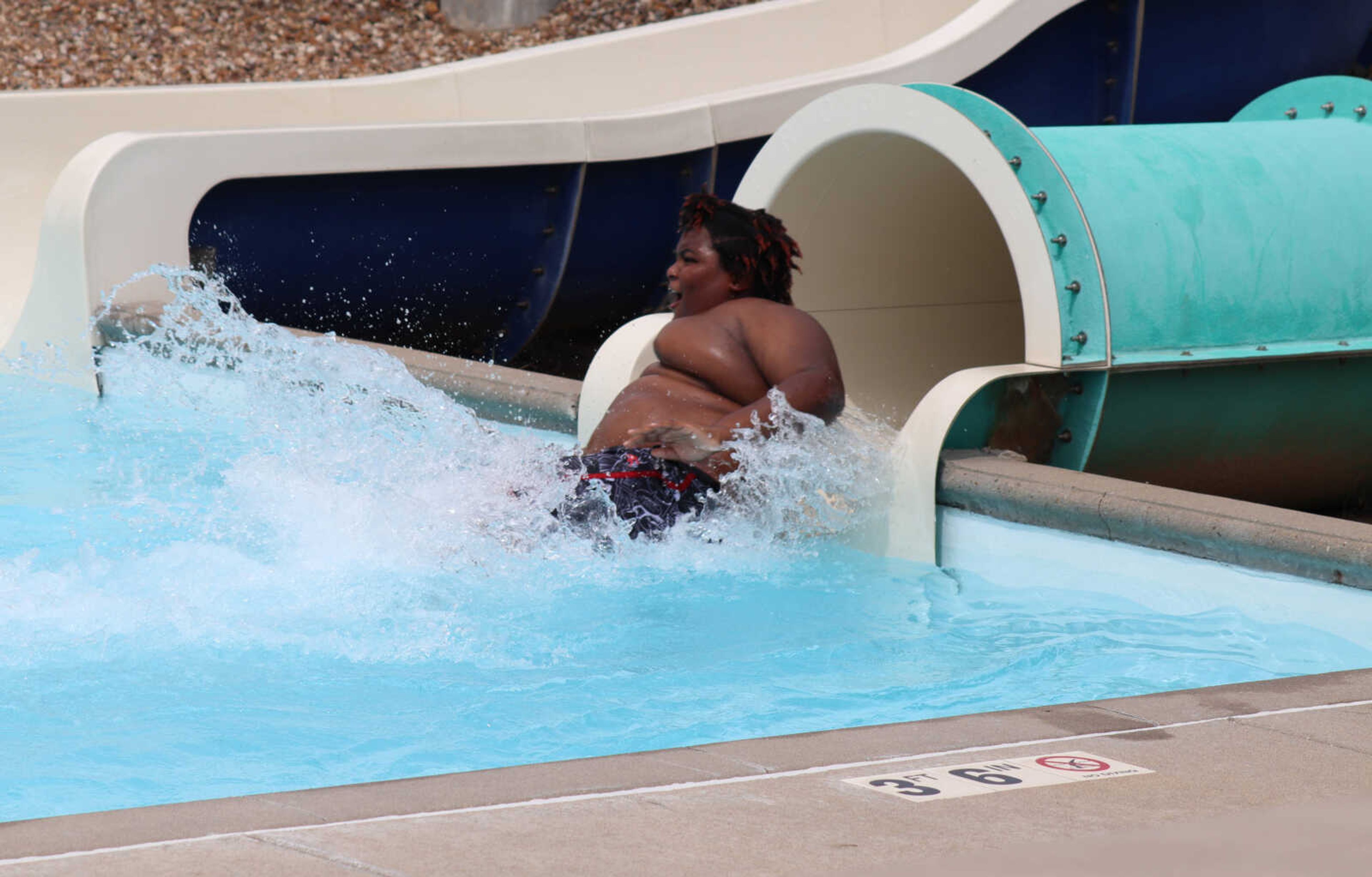 Tank Dorsey crashing into the water after making his way down slide at the Cape Splash water park on Thursday.