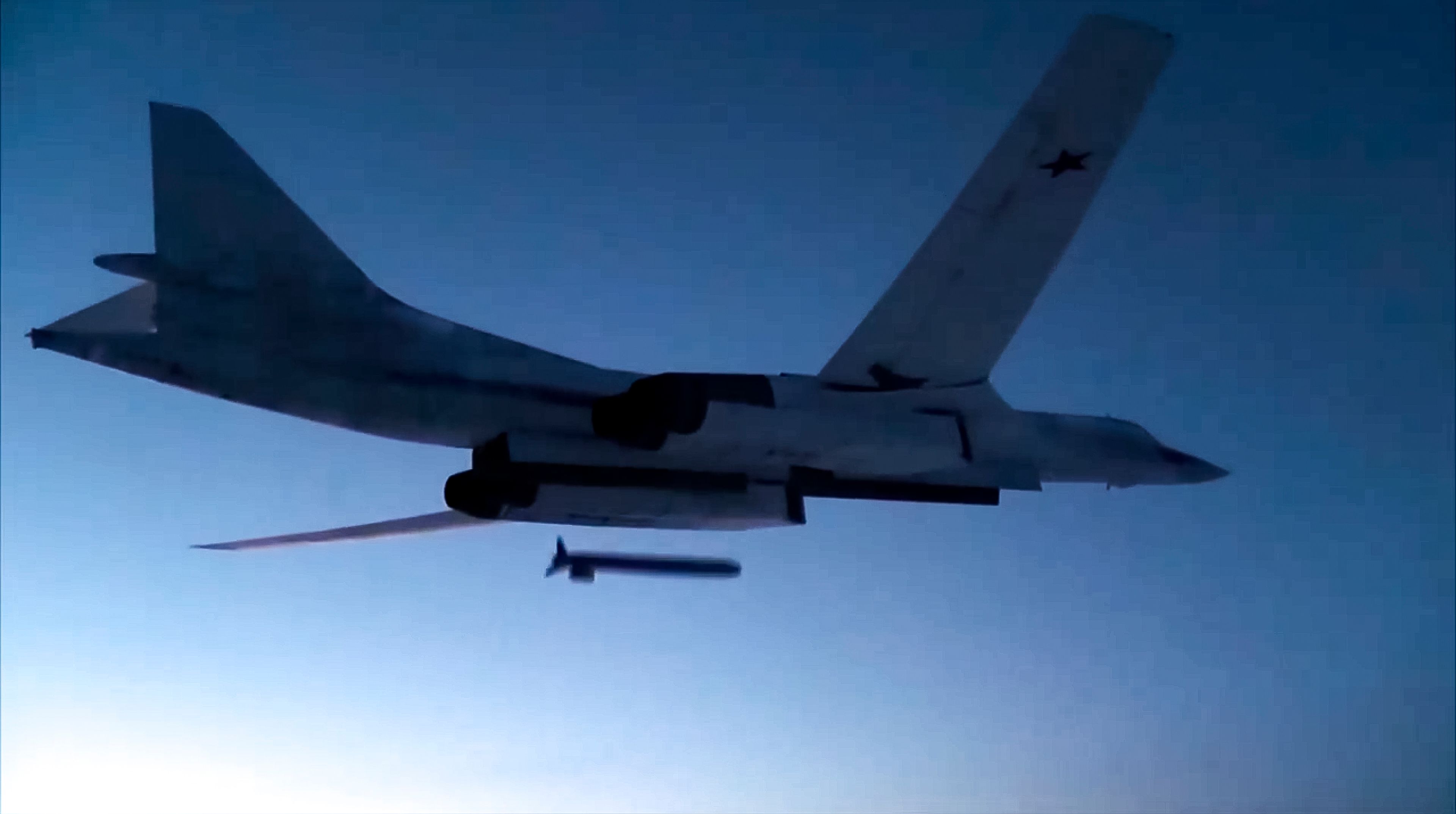 FILE - In this image taken from a video distributed by Russian Defense Ministry Press Service, on Dec. 9, 2020, a Russian Tu-160 strategic bomber fires a cruise missile at test targets, during a military drills in Russia. (Russian Defense Ministry Press Service via AP, File)