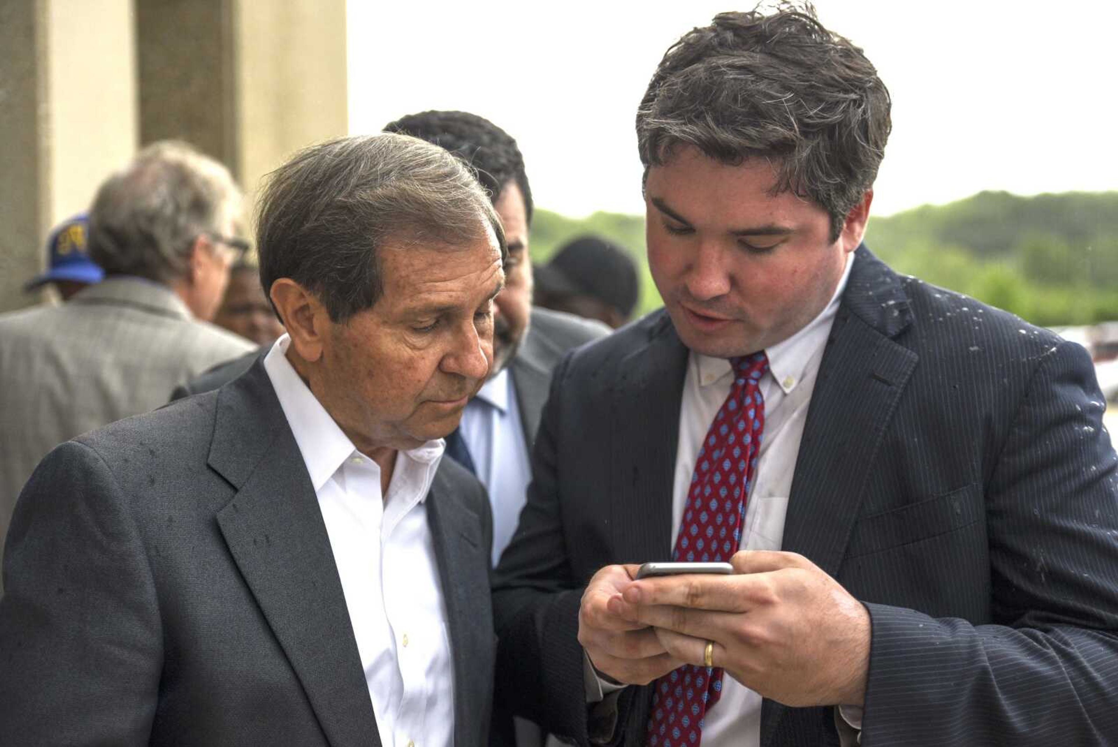 Attorneys Charlie Weiss, left, and Jonathan Potts read the Missouri attorney general's statement about David Robinson's innocence and release Monday in Jefferson City, Missouri.