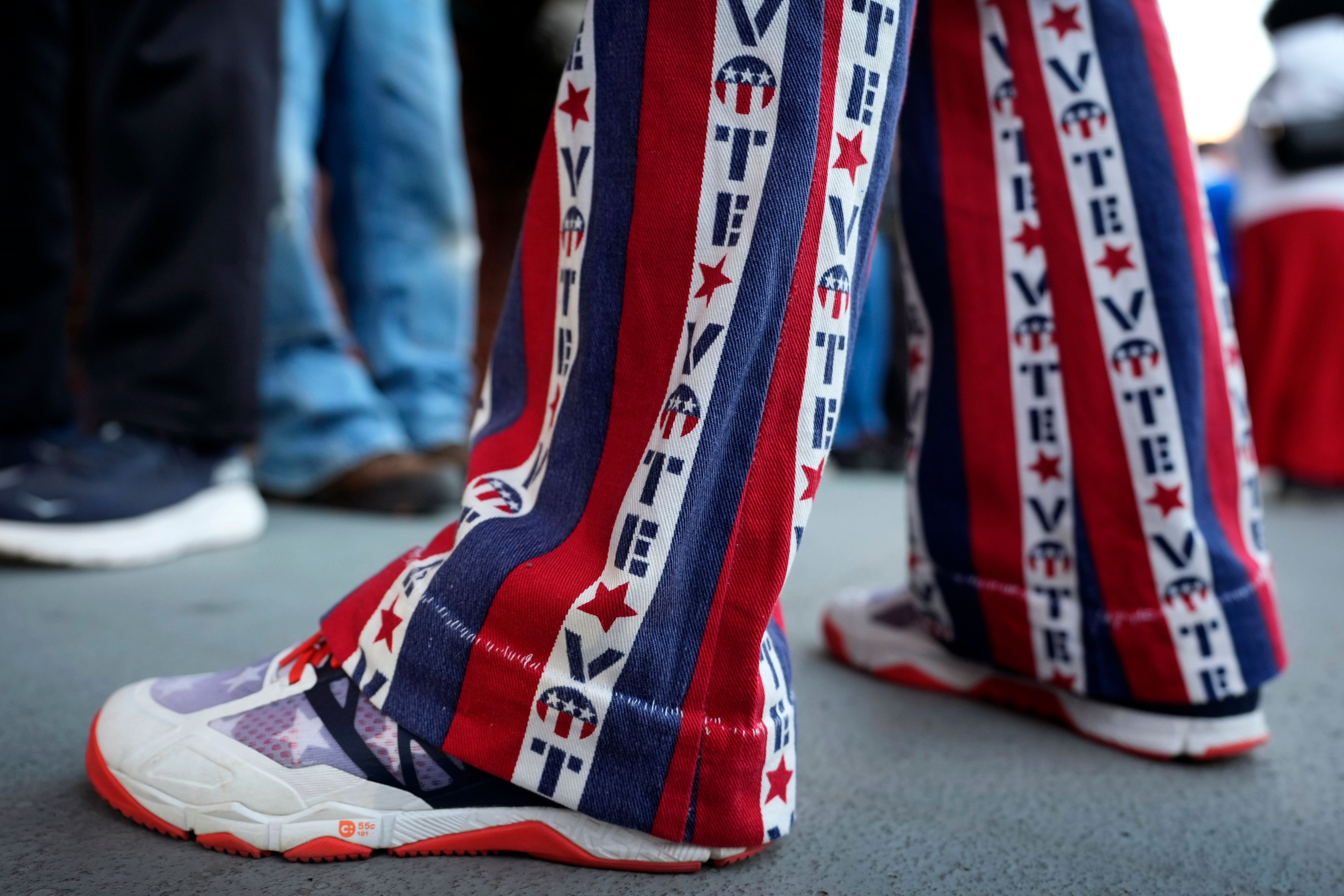 John Olsen, of Ankeny, Iowa, stands in line for early voting at the Polk County Election Office, Wednesday, Oct. 16, 2024, in Des Moines, Iowa. (AP Photo/Charlie Neibergall)