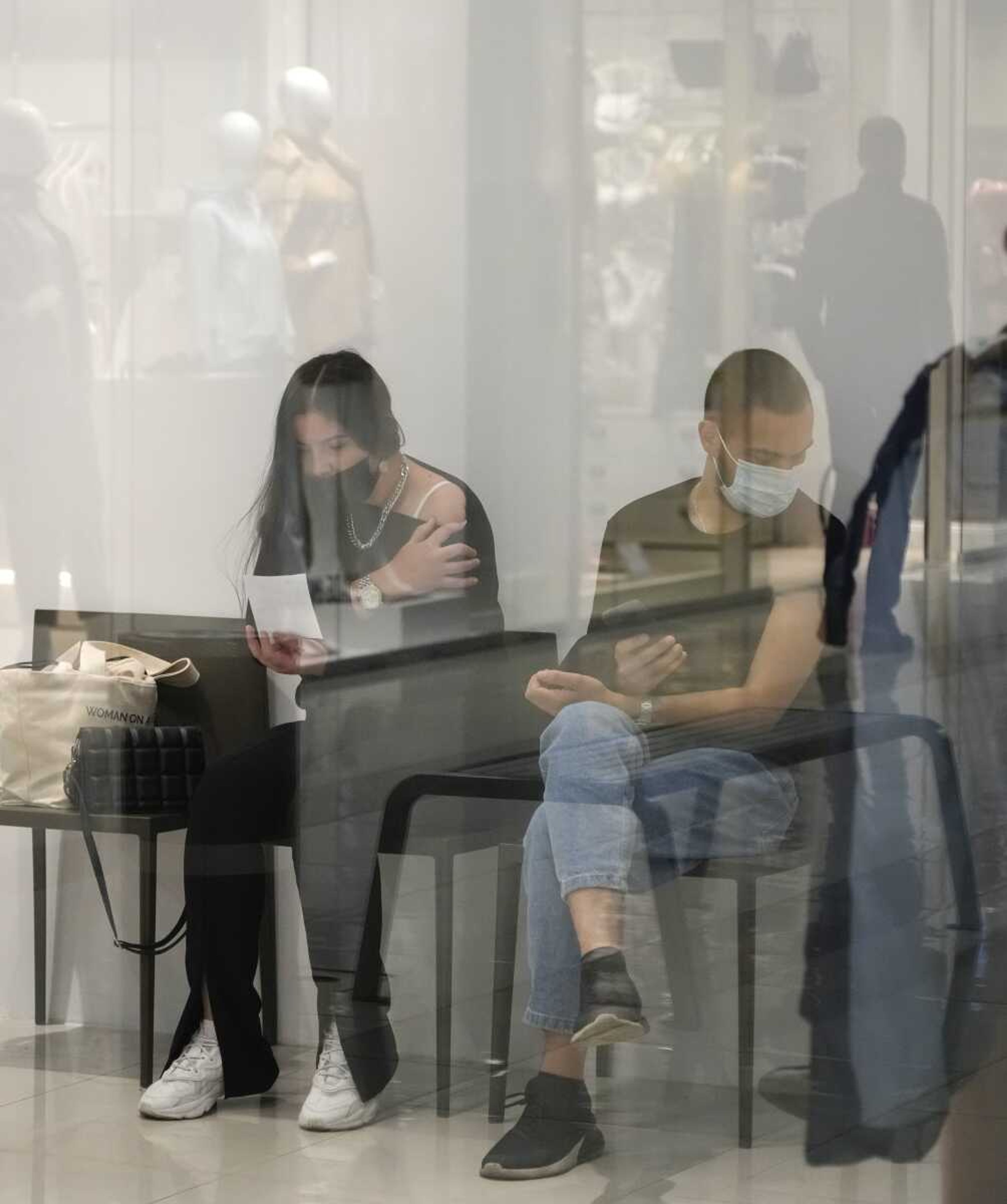 People wait for their turn in a vaccination center in a city mall Thursday in Kyiv, Ukraine.