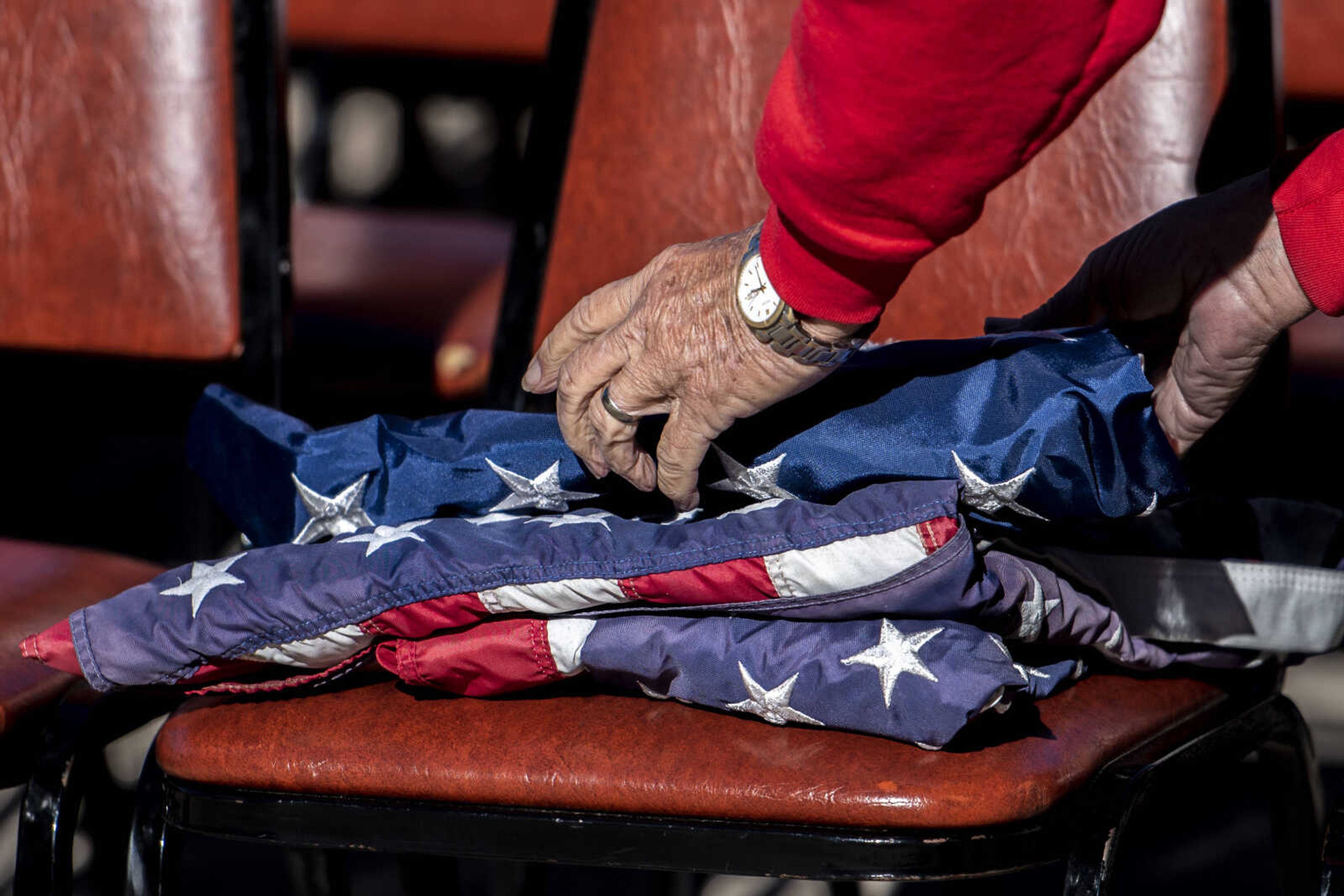 Jerry Hampton prepares worn-down American flags for the retirement ceremony before the start of the inaugural flag retirement ceremony at VFW Post 3838 Sunday, Oct. 21, 2018, in Cape Girardeau.