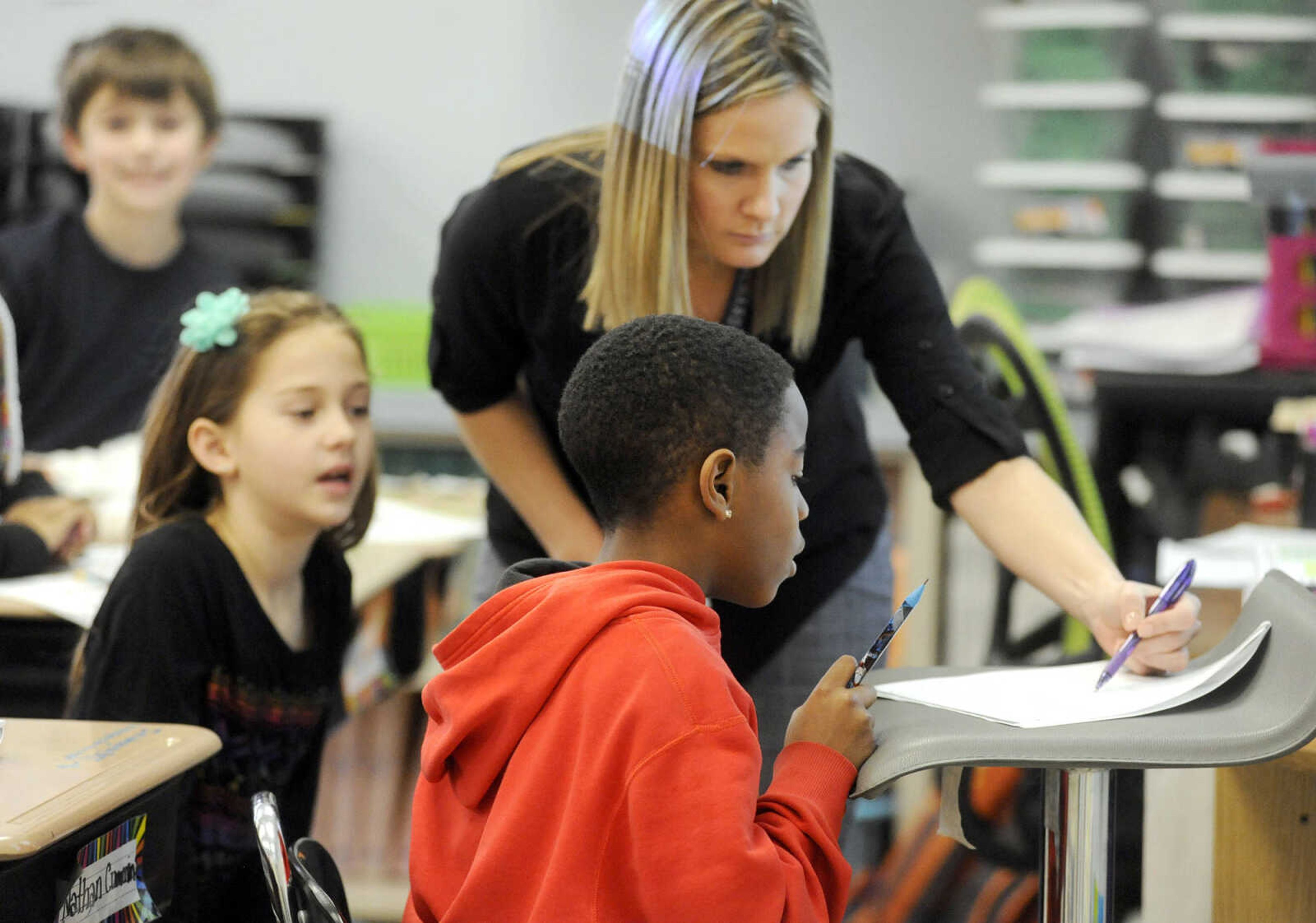 LAURA SIMON ~ lsimon@semissourian.com

Blanchard Elementary third grade teacher, Amber Walker, helps a student with a math problem, Monday, Feb. 8, 2016. The Cape Girardeau school was named a National Blue Ribbon School by the U.S. Department of Education.