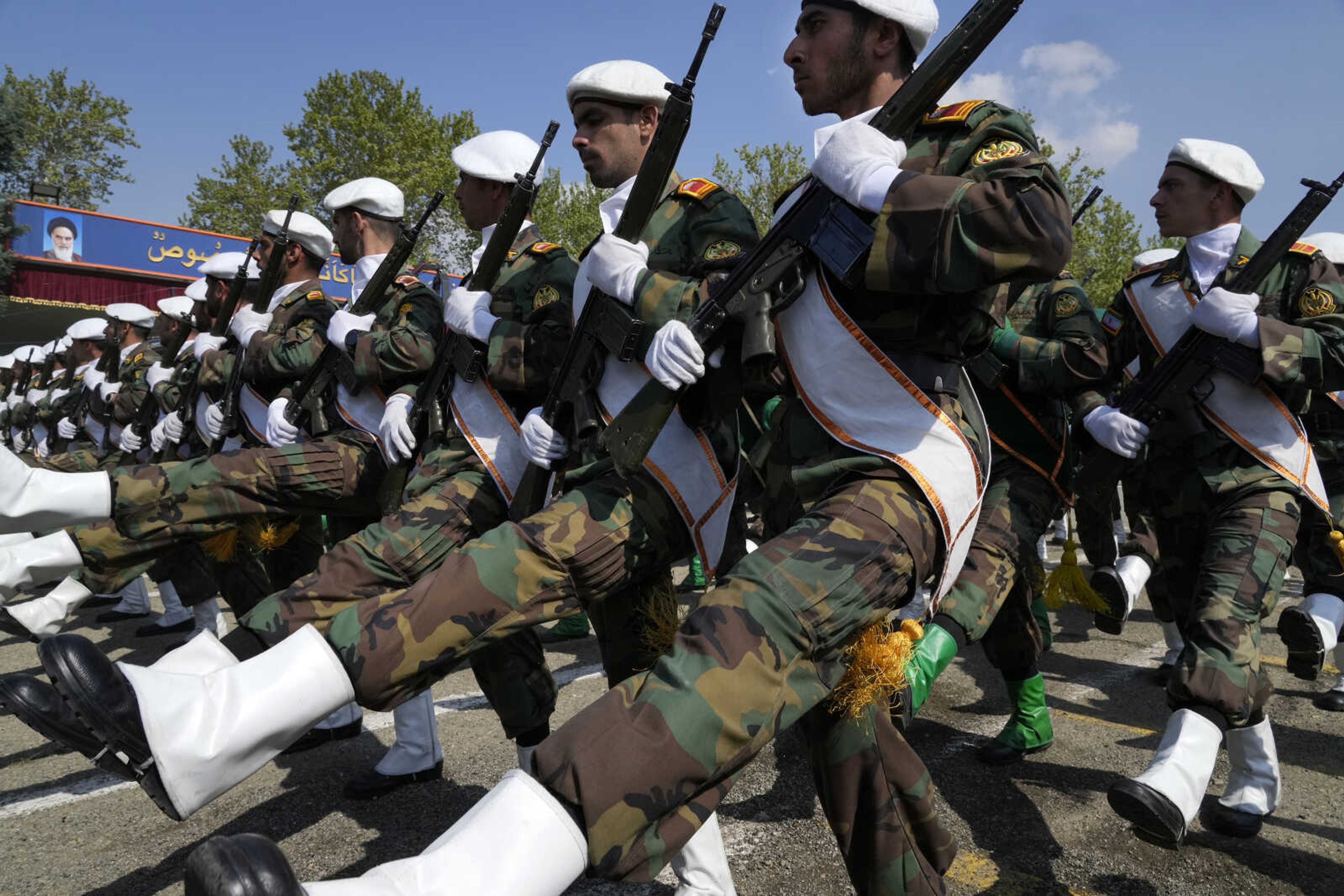 Iranian army members march during Army Day parade at a military base in northern Tehran, Iran, Wednesday, April 17, 2024. In the parade, President Raisi warned that the  tiniest invasion  by Israel would bring a  massive and harsh  response, as the region braces for potential Israeli retaliation after Iran's attack over the weekend. (AP Photo/Vahid Salemi)