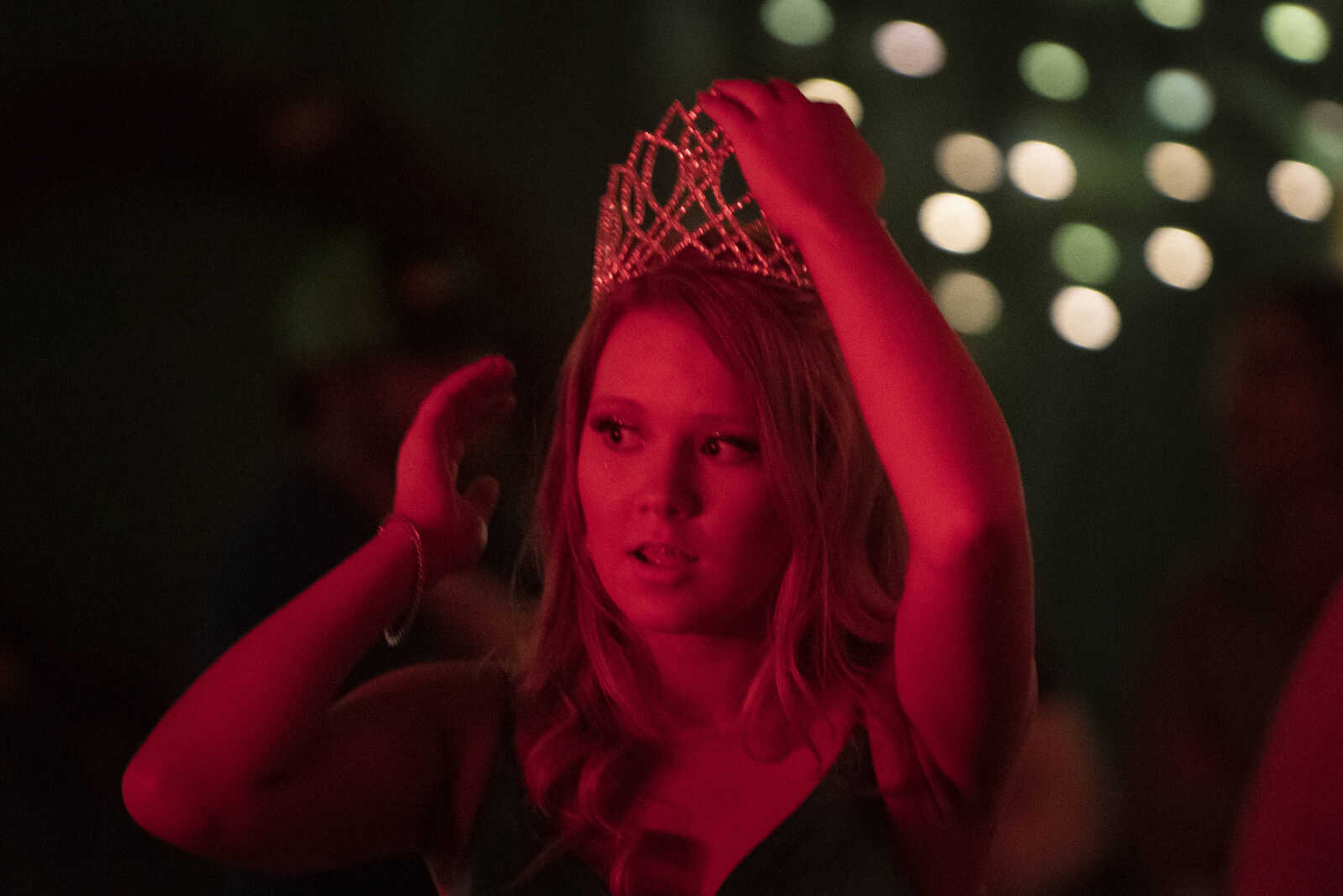 Delta prom queen and senior Shana Burden puts her hand on the crown during Delta High School's prom on Saturday, April 13, 2019, at the Delta Community Center.