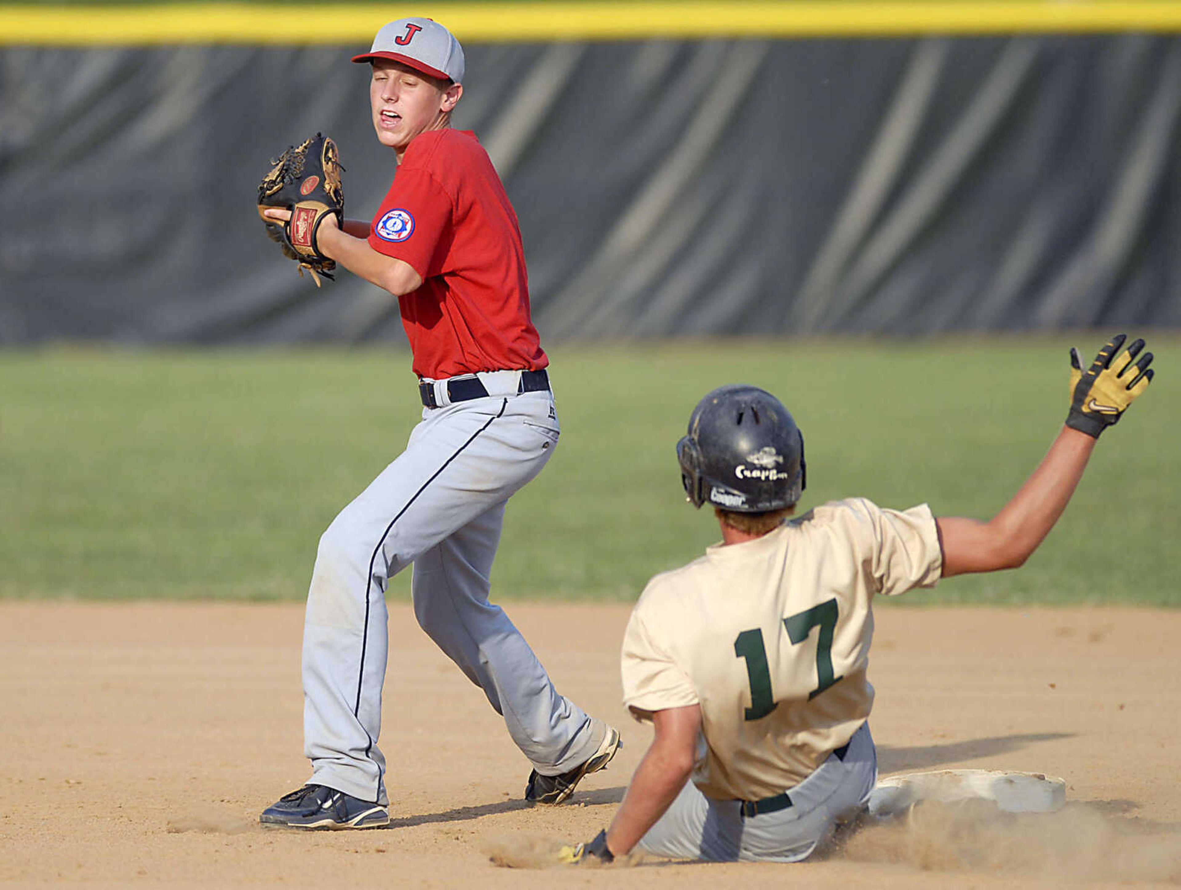 KIT DOYLE ~ kdoyle@semissourian.com
Jackson second baseman Spencer Sander forces out Brandon Bennett but fails to complete a double play Monday evening, July 6, 2009, in a Senior Babe Ruth game at Jackson City Park.