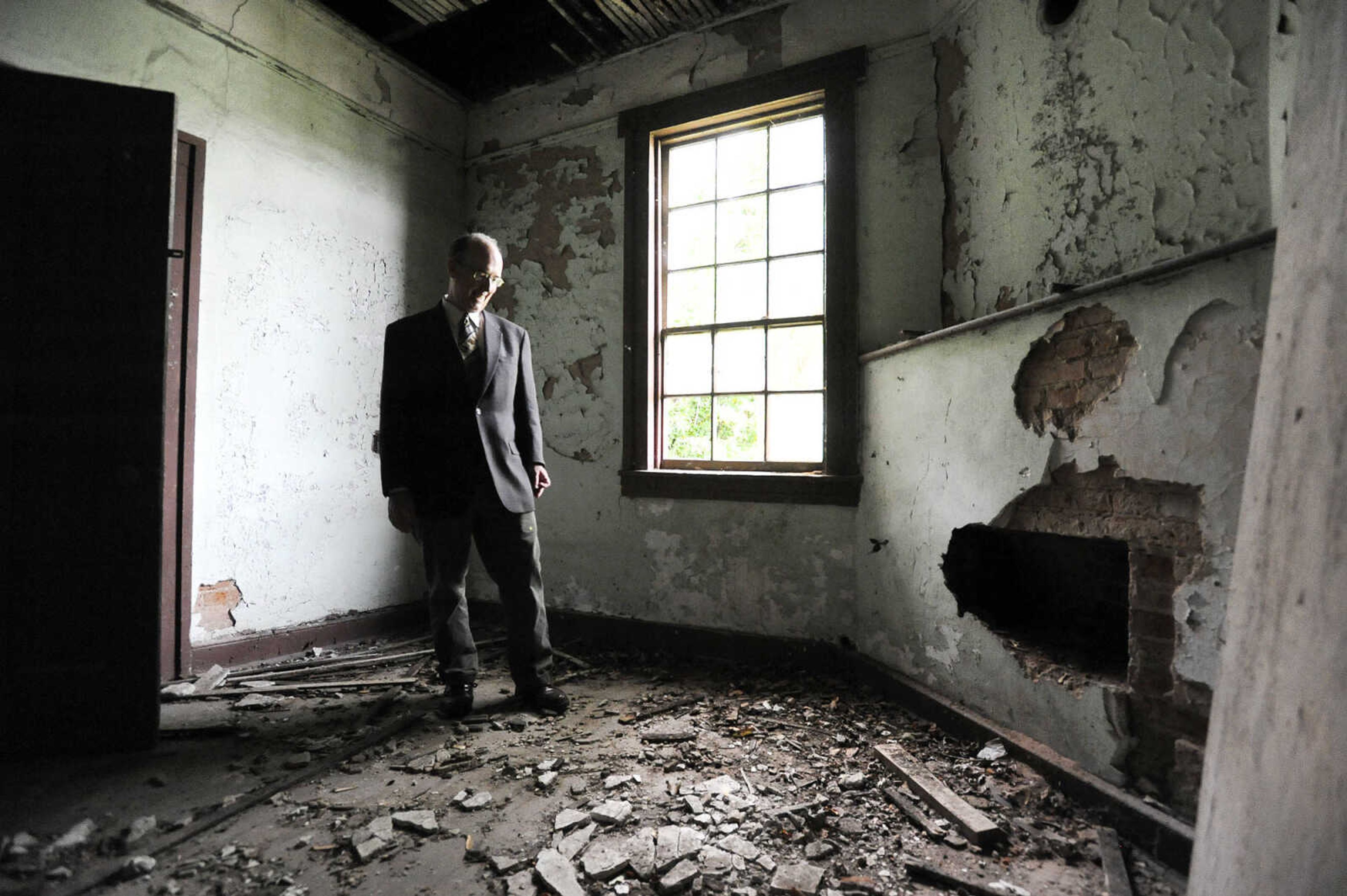 LAURA SIMON ~ lsimon@semissourian.com

Steven Hoffman, coordinator of Southeast Missouri State University's  historic preservation program, stands in a central room of the historic Reynolds House Monday afternoon, May 2, 2016. The Cape Girardeau house, which stands at 623 N. Main Street, was built in 1857.