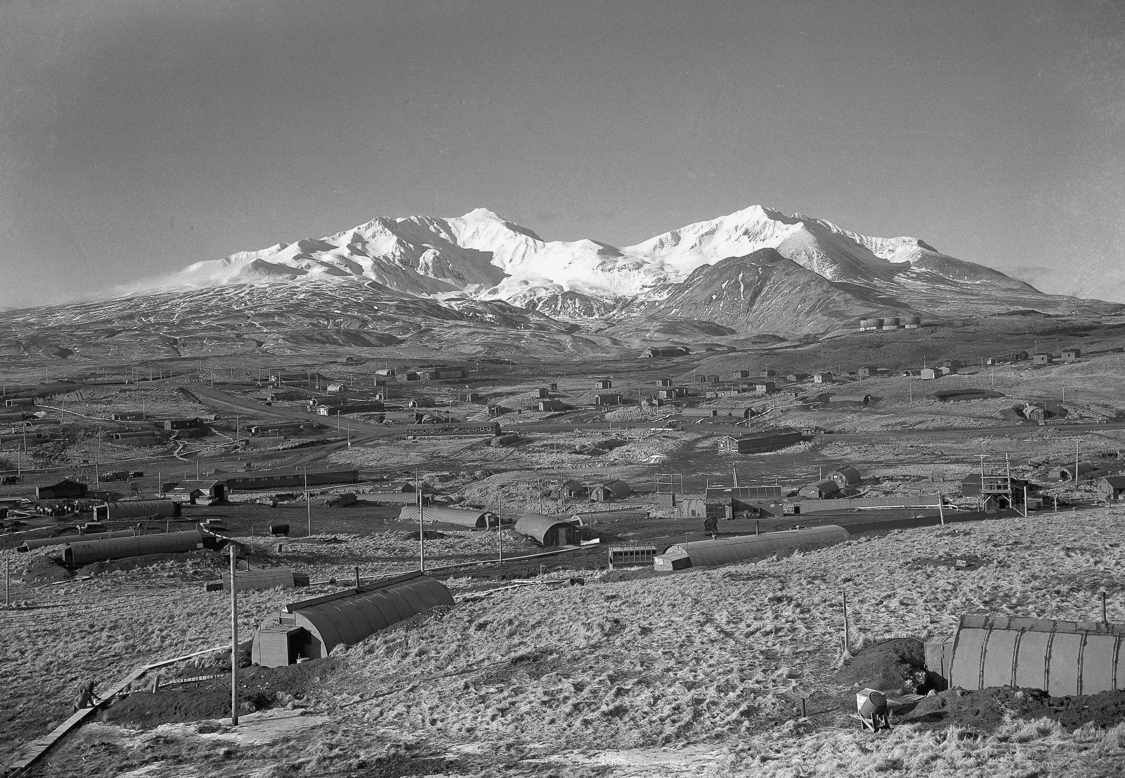 FILE - Army's task force Williwaw camp on Alaska's Adak Island, on Feb. 3, 1947, with Mount Moffett in background. (AP Photo/Joseph D. Jamieson, File)