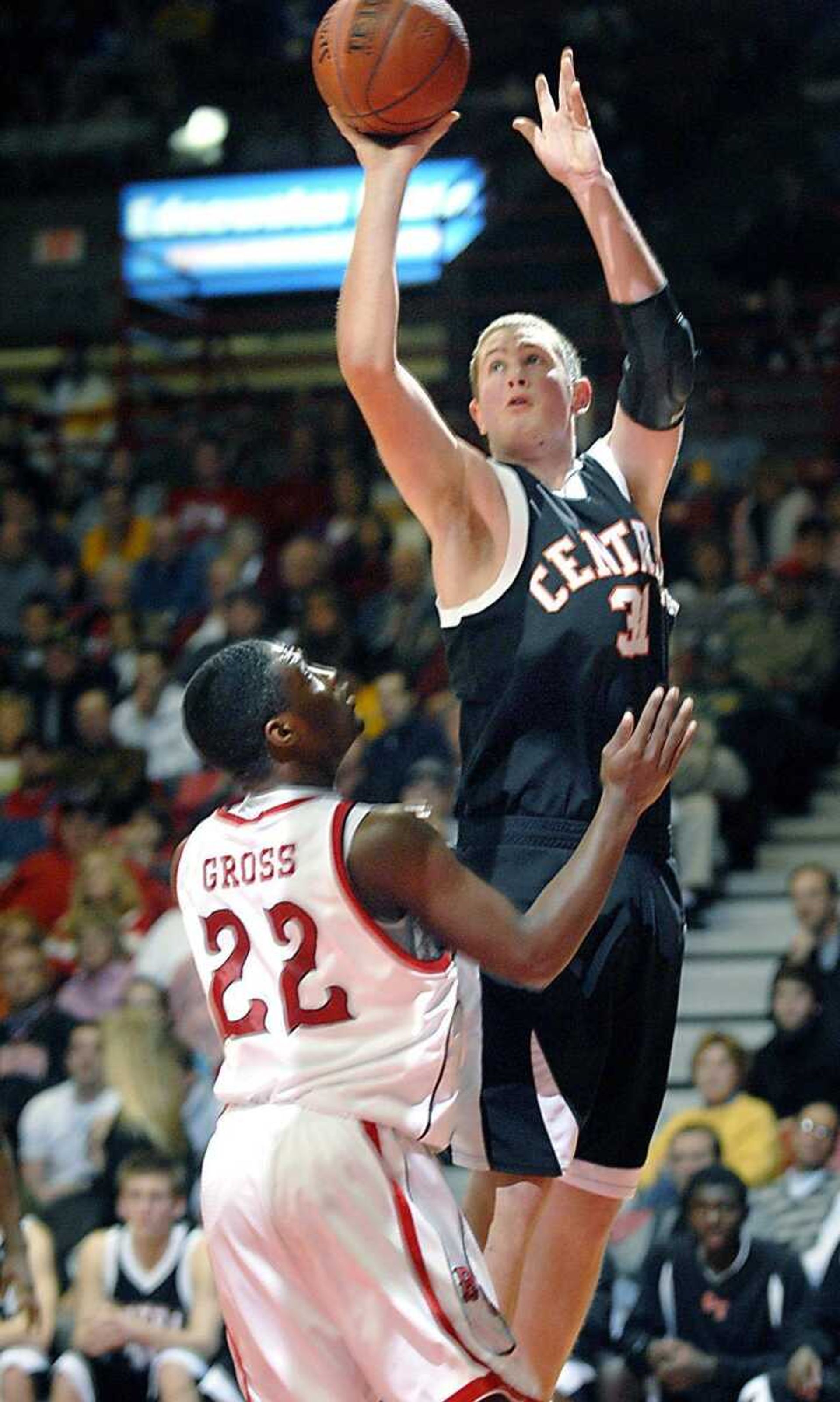 Central freshman Zack Boerboom shot over Bell City's Phillip Gross. (Kit Doyle)