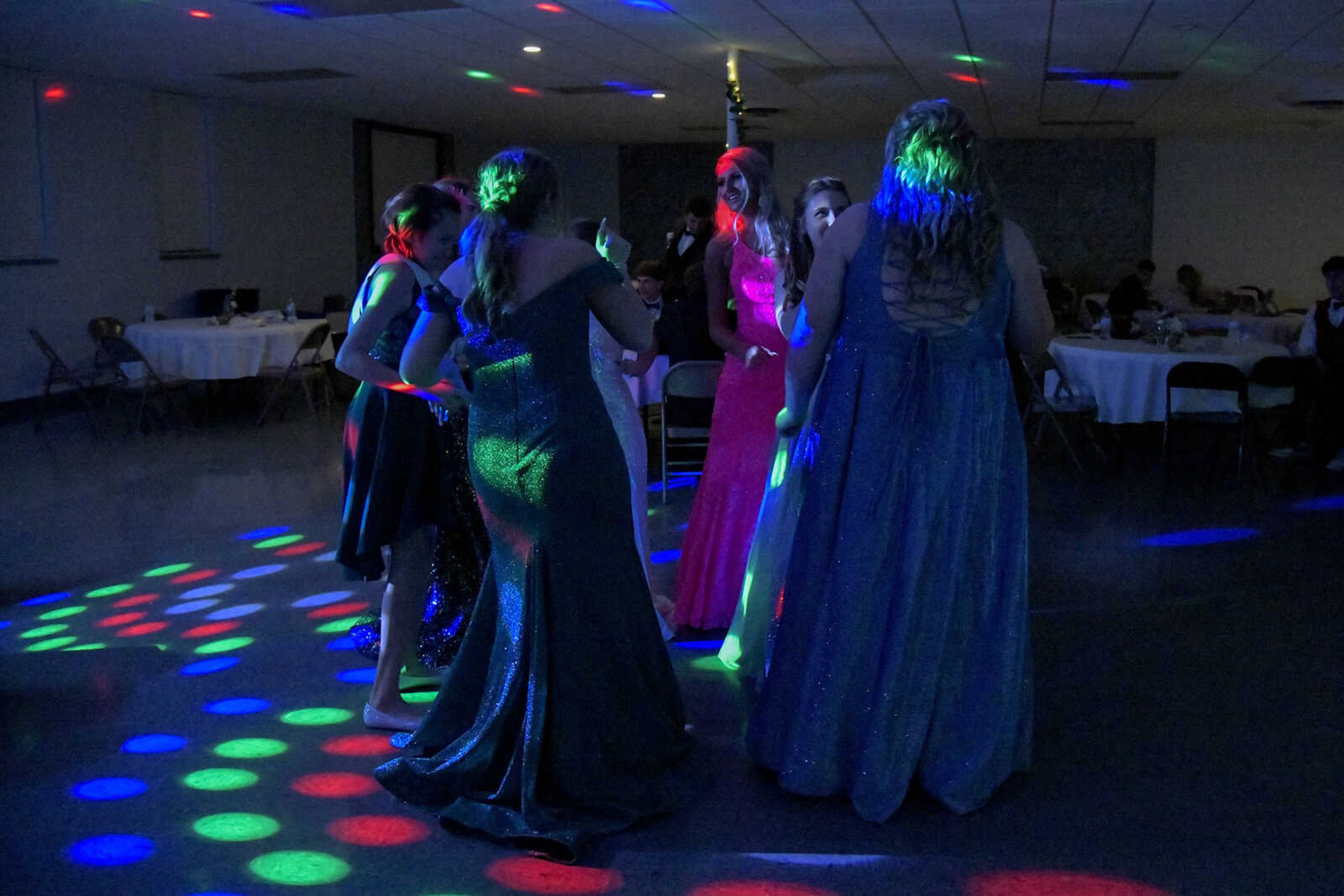 Students dance in a group during prom at the Front Porch in Scott City on Saturday, April 24, 2021.