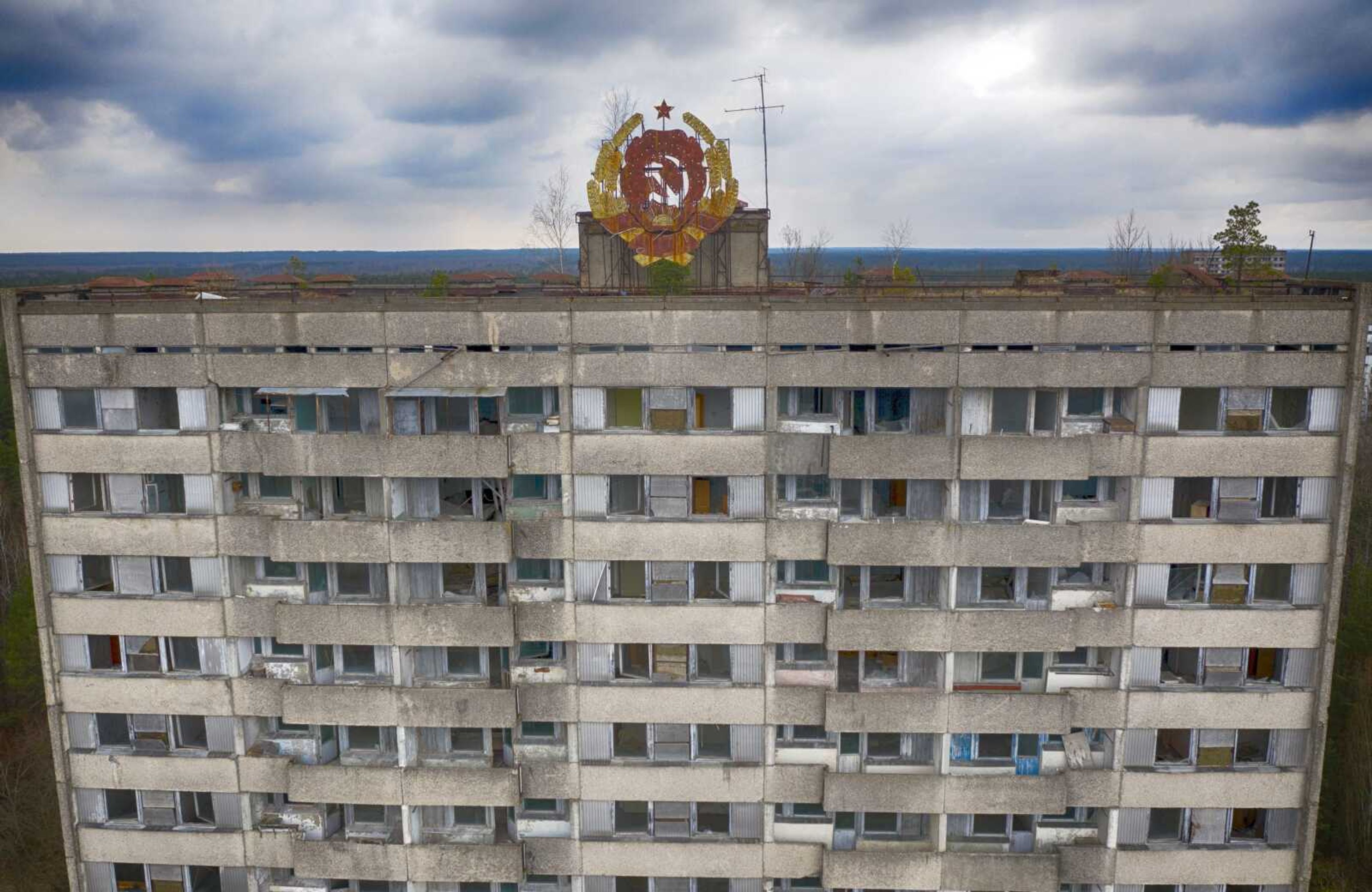 The rusty emblem of the Soviet Union is seen on the roof of an apartment building in the ghost town of Pripyat close to the Chernobyl nuclear plant April 15 in Ukraine.