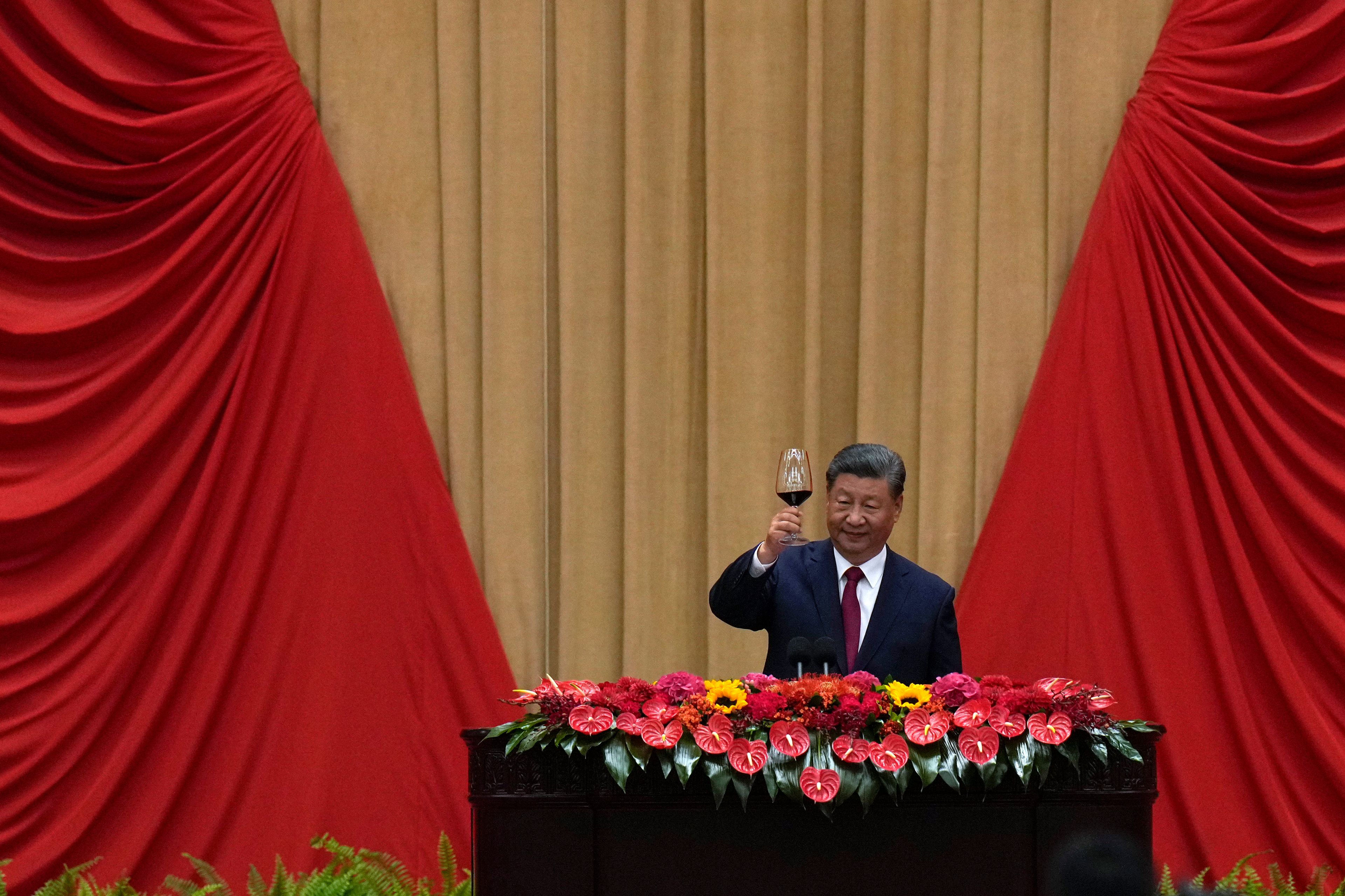 Chinese President Xi Jinping makes a toast on stage after delivering his speech at a dinner marking the 75th anniversary of the founding of the People's Republic of China, at the Great Hall of the People in Beijing, Monday, Sept. 30, 2024. (AP Photo/Andy Wong)