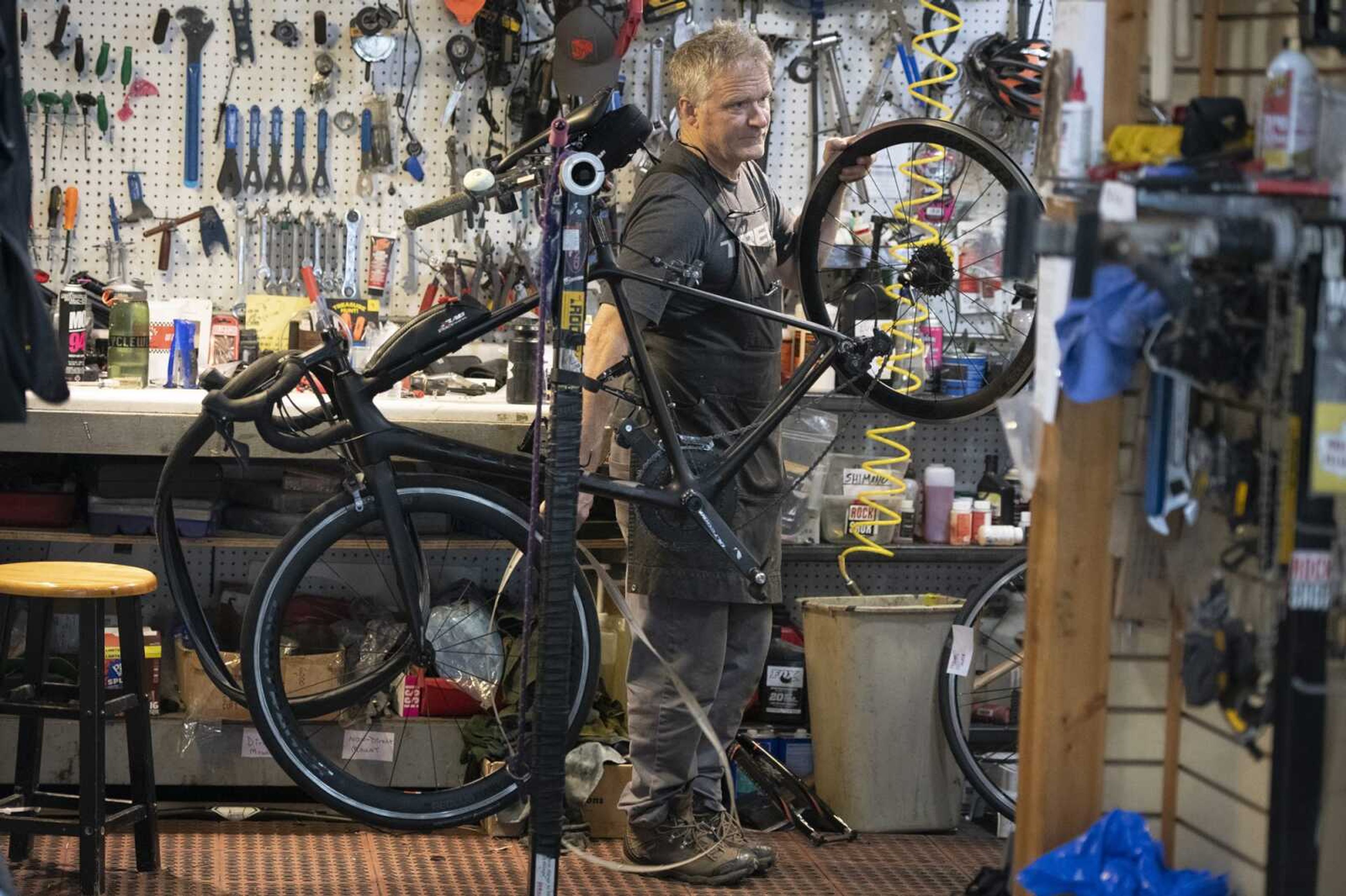 CYCLEWERX owner John Dodd of Cape Girardeau works on a bike Thursday at the shop in Cape Girardeau.