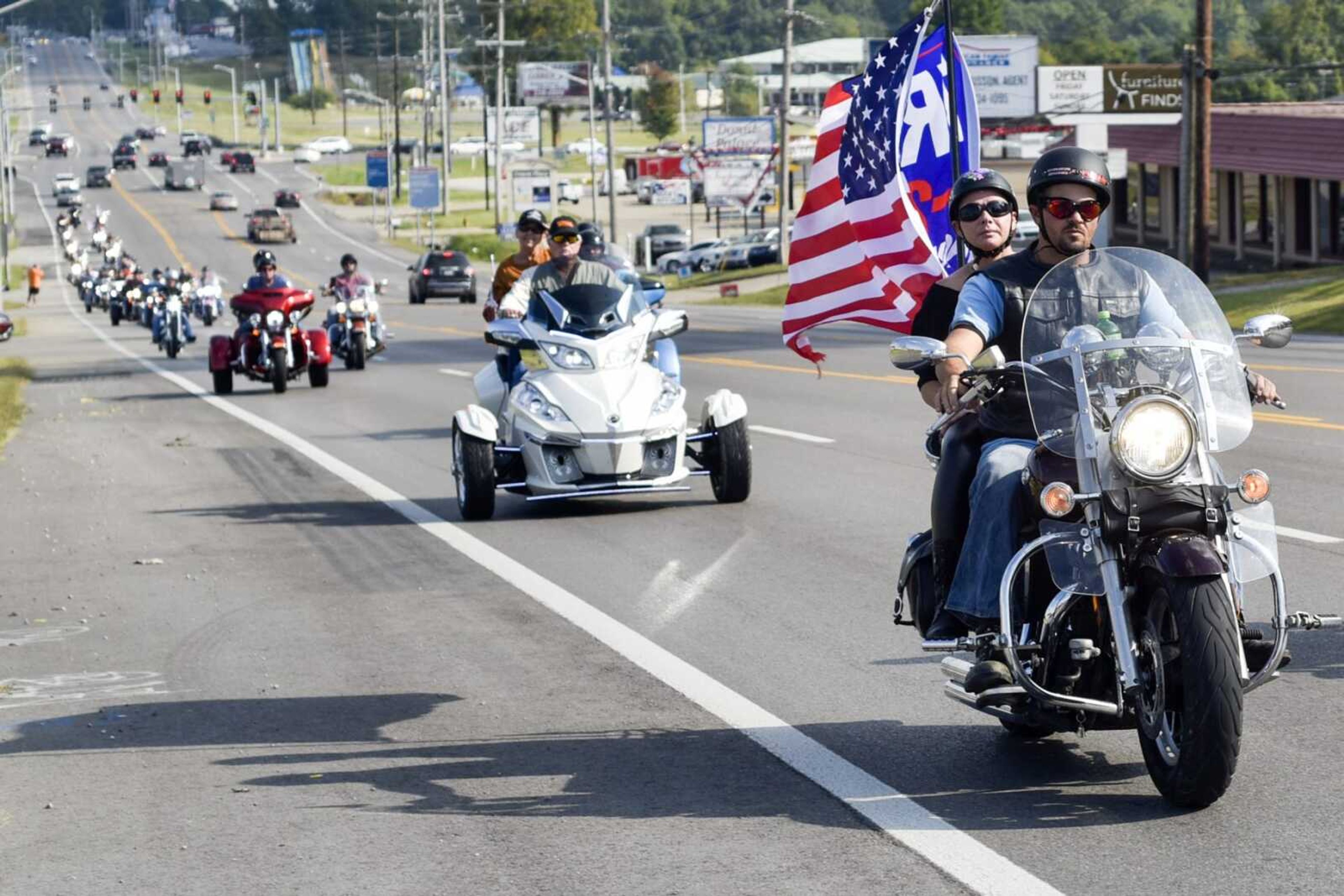 A group of motorcyclists travel out of Cape Girardeau while driving in a "Freedom Ride for 45" parade Sunday, with hundreds of other vehicles. Beginning in downtown Cape Girardeau, the parade route passed homes and businesses along Broadway and North Kingshighway before crossing into Jackson and ending with food at the St. Louis Iron Mountain Railway.