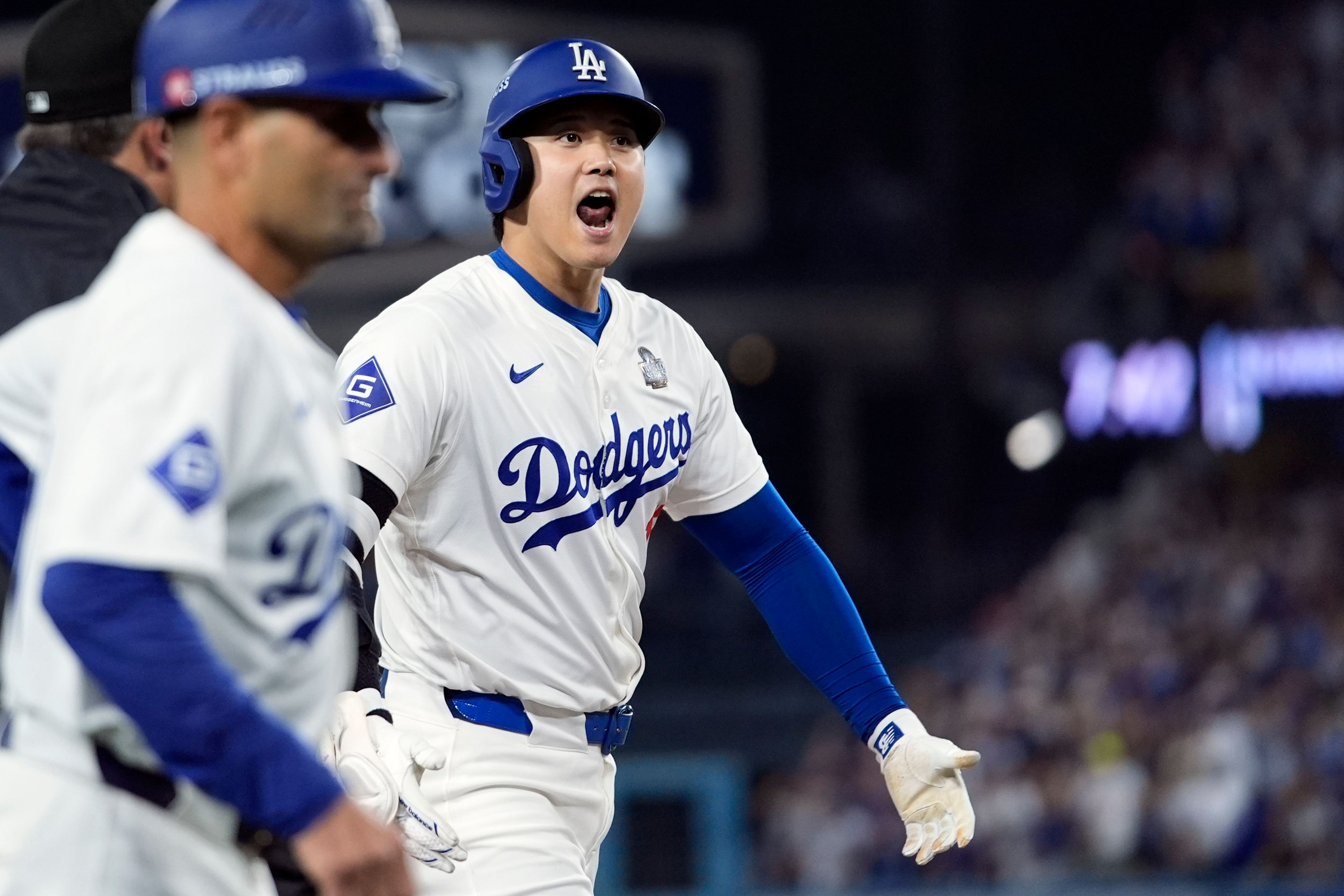 Los Angeles Dodgers' Shohei Ohtani reacts after advancing to third on a fielding error by New York Yankees second baseman Gleyber Torres during the eighth inning in Game 1 of the baseball World Series, Friday, Oct. 25, 2024, in Los Angeles. (AP Photo/Godofredo A. Vásquez)