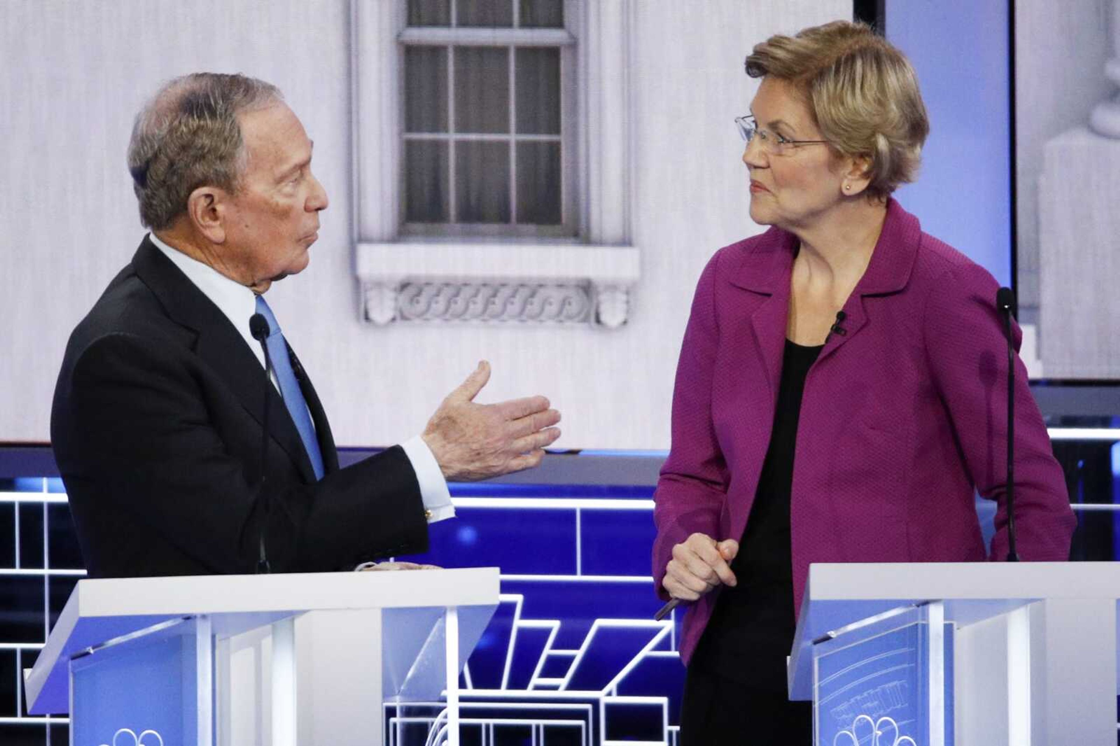 Democratic presidential candidates, former New York City Mayor Mike Bloomberg, left, and Sen. Elizabeth Warren, D-Mass., talk during a break at a Democratic presidential primary debate Wednesday, Feb. 19, 2020, in Las Vegas, hosted by NBC News and MSNBC. (AP Photo/John Locher)