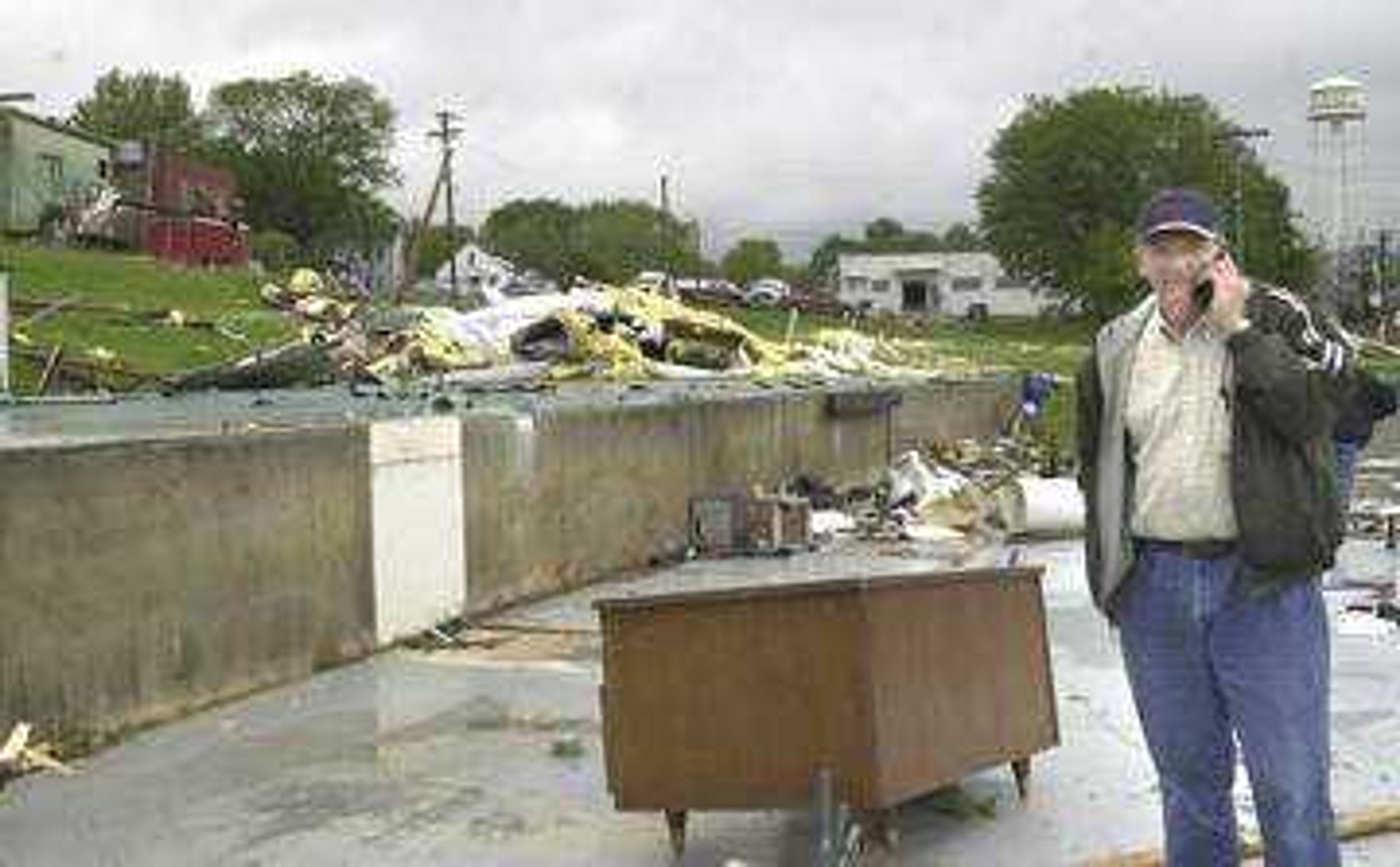 Larry Stone, owner of what was the K-9 Training Center used his cellular telephone to discuss the destruction of his business after Tuesday night's tornado which ripped through Jackson.