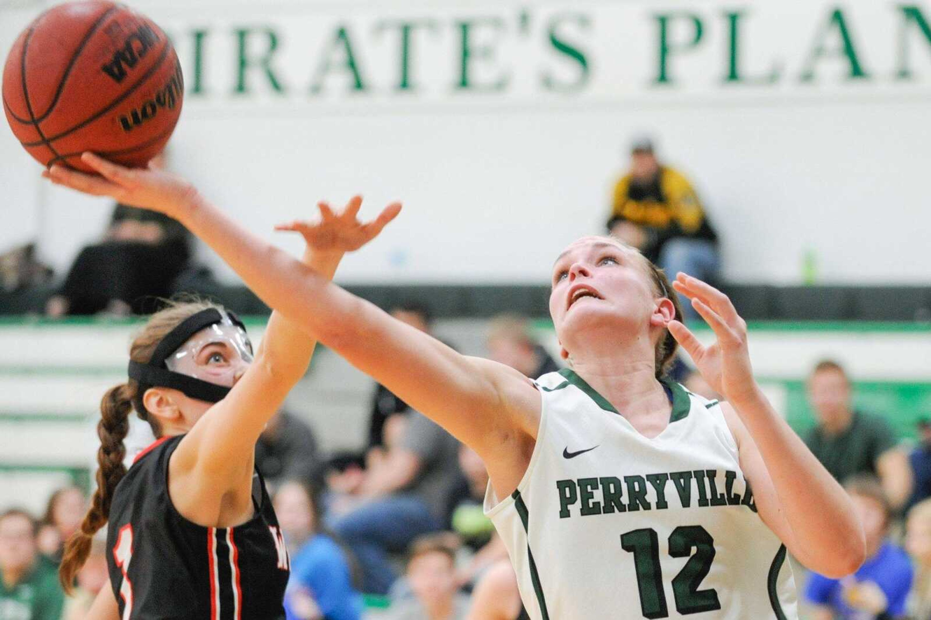 Perryville's Ahnie Hoff puts a shot up against Woodland during the fourth quarter Thursday in Perryville, Missouri. The Pirates won 51-46 in overtime.