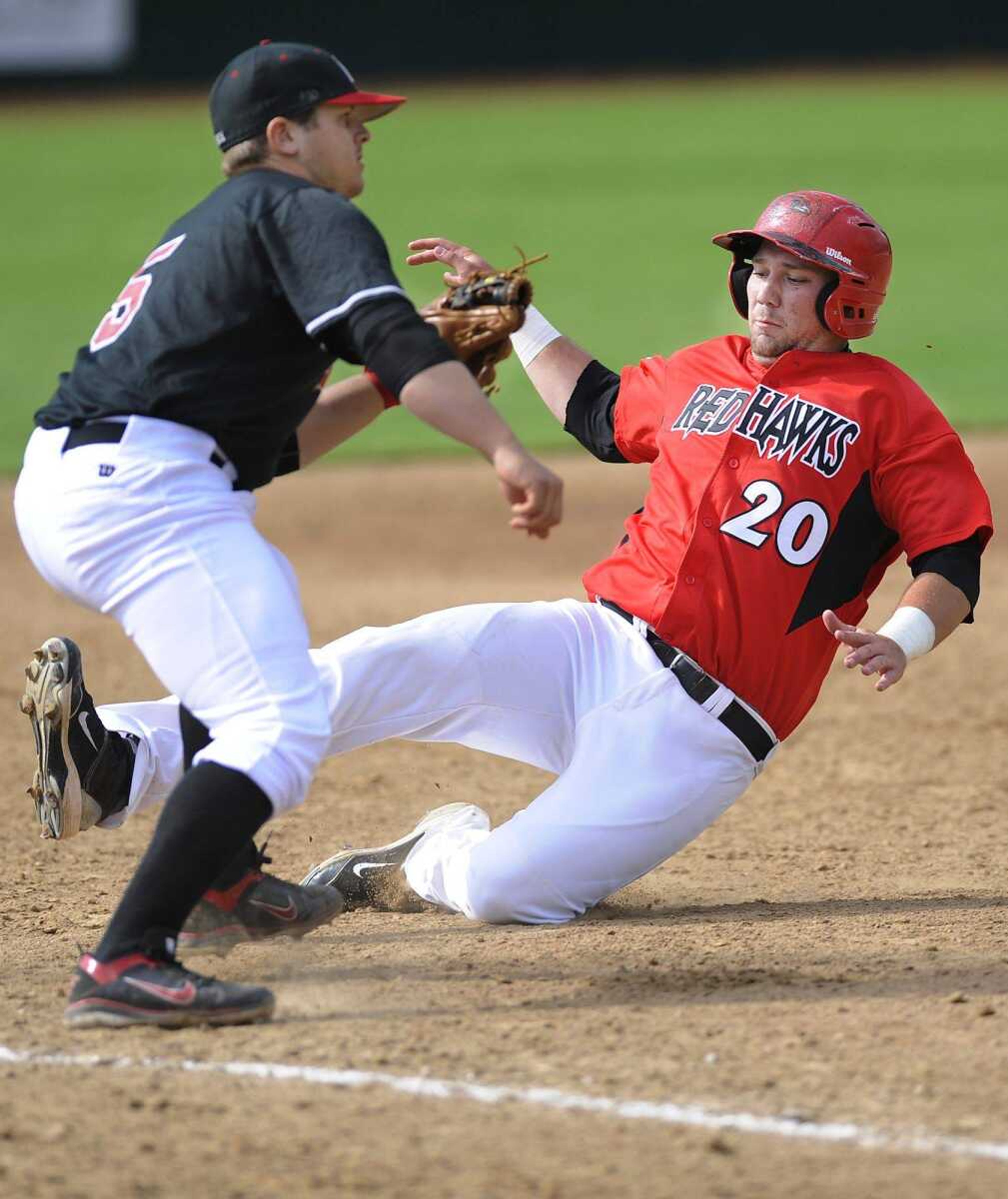 Southeast Missouri State&#8217;s Kody Cambell advances safely to third base on a groundout by Cole Bieser during the eighth inning Saturday at Capaha Field. Austin Peay third baseman Greg Bachman waits for the throw from first. (ADAM VOGLER)