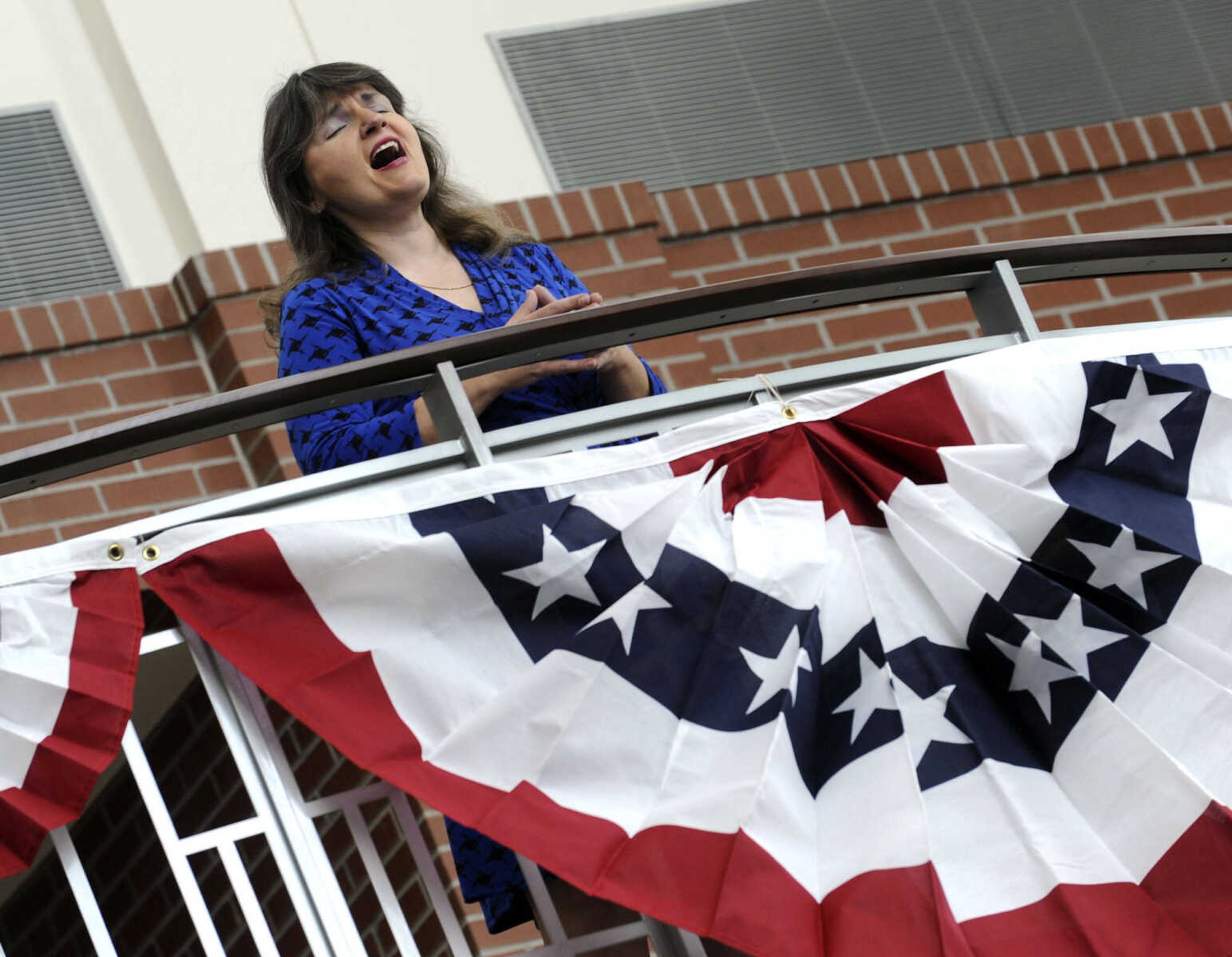 Trudy Lee sings "America the Beautiful" during a naturalization ceremony Friday, May 2, 2014 at the Rush H. Limbaugh Sr. U.S. Courthouse in Cape Girardeau.