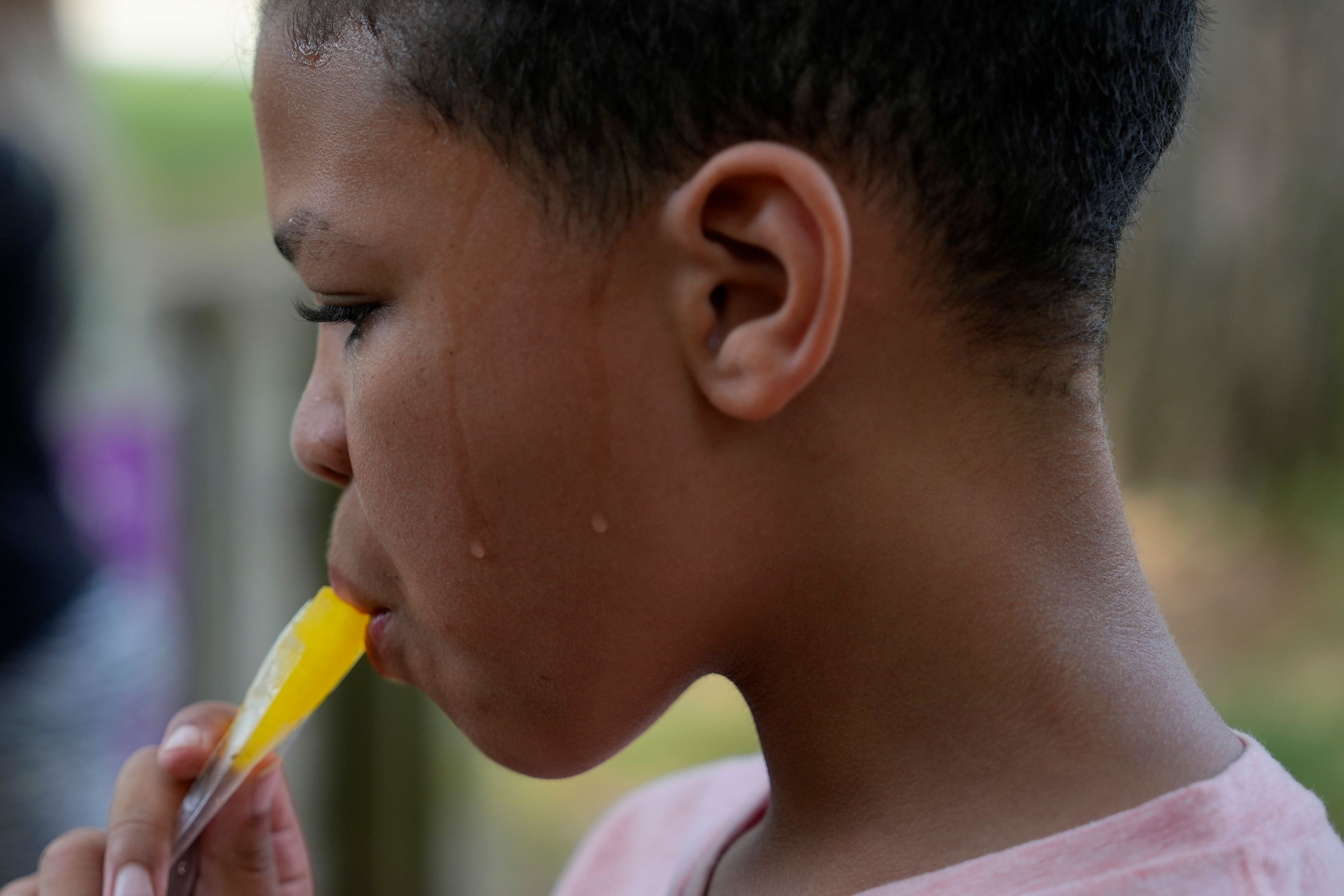 FILE - Zariah Fields eats a popsicle, June 20, 2024, at YMCA Camp Kern in Oregonia, Ohio. (AP Photo/Joshua A. Bickel, File)