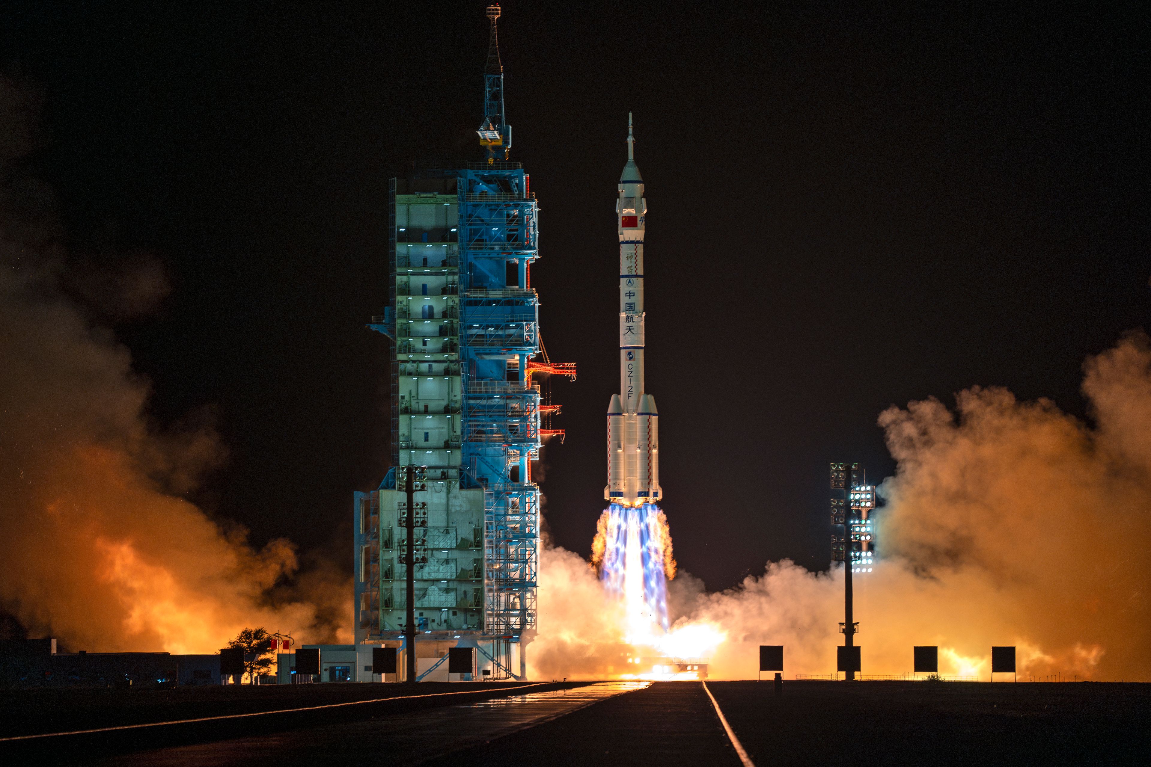 A Long March rocket with a Shenzhou-19 spacecraft atop takes off from the Jiuquan Satellite Launch Center in Jiuquan, northwestern China in the early hours of Wednesday, Oct. 30, 2024. (AP Photo/Ng Han Guan)