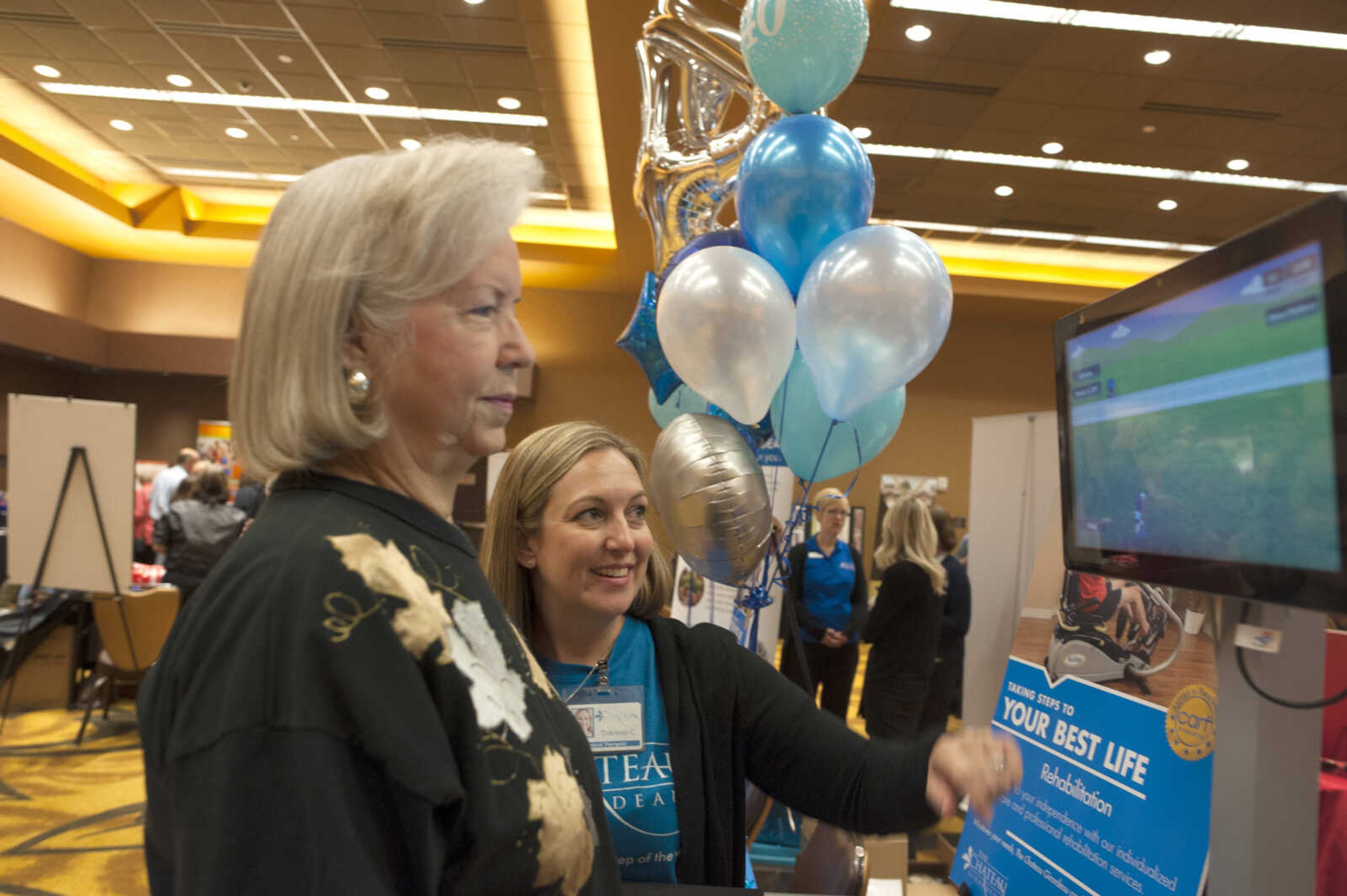 Phyllis Diebold, left, plays a balancing game with the Chateau Girardeau's Theresa Crowell during the TBY Active Living Expo Wednesday, Oct. 9, 2019, at the Isle Casino in Cape Girardeau.