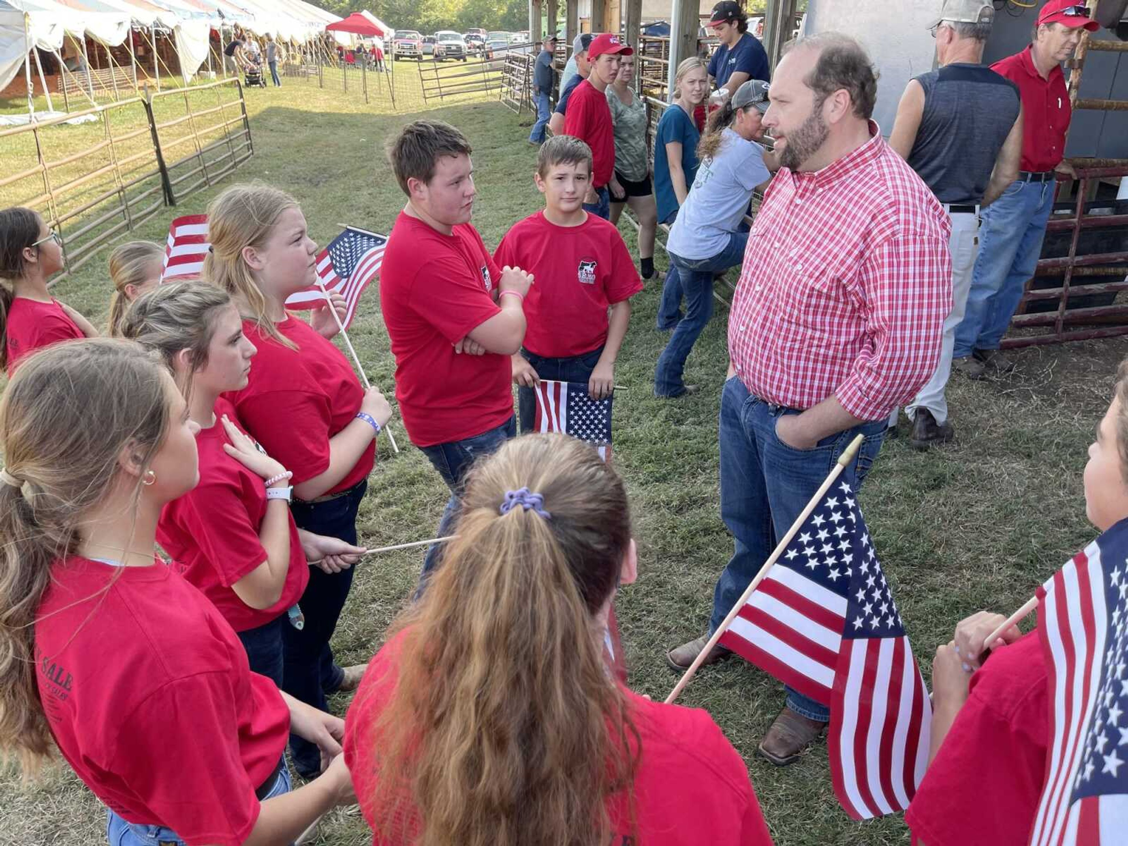 U.S. Rep. Jason Smith, who represents the state's 8th District, speaks with SEMO District Fair livestock winners before Thursday night's auction at Arena Park in Cape Girardeau.