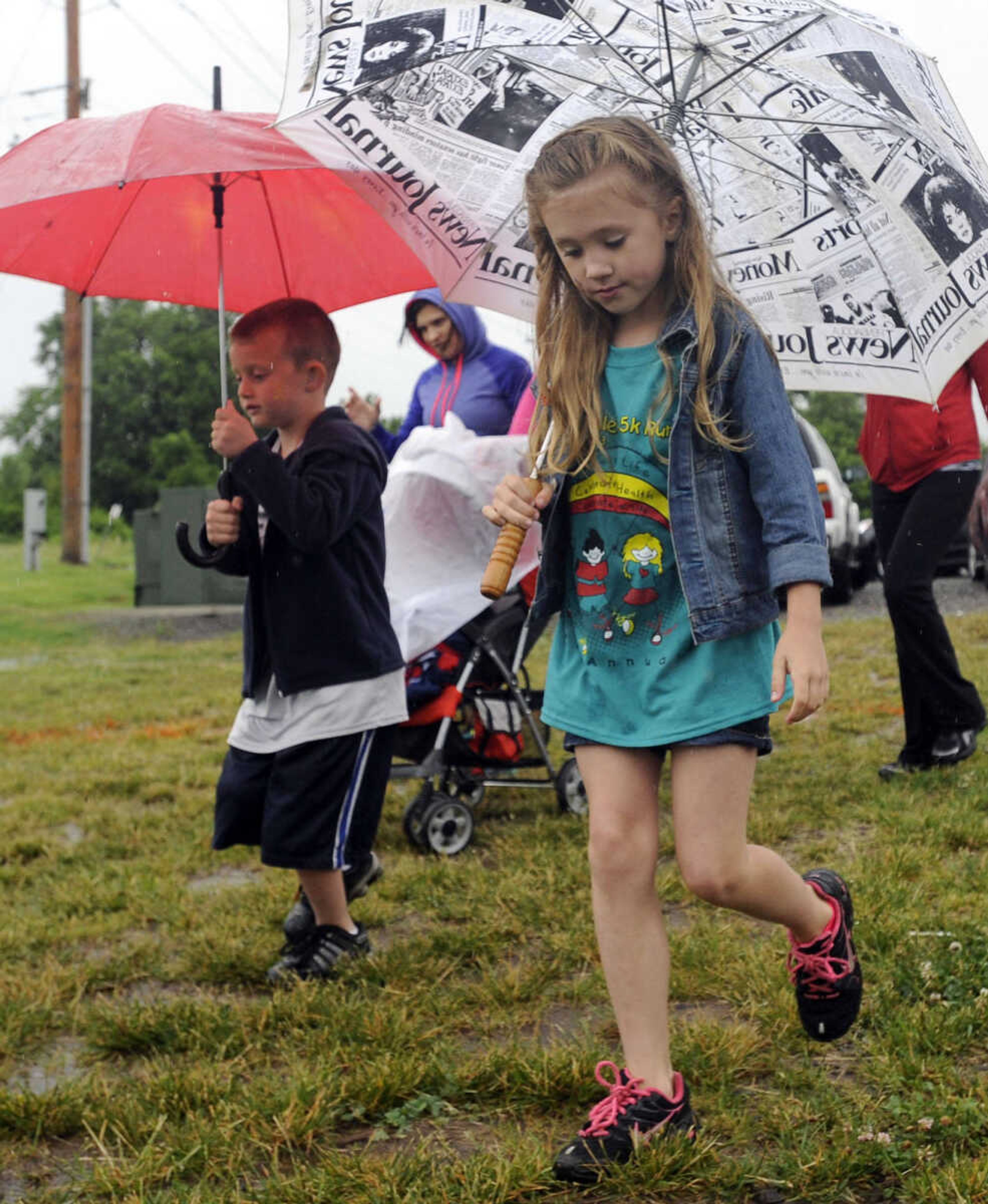 FRED LYNCH ~ flynch@semissourian.com
Walkers begin a 1-mile family wellness walk at the Jacque Waller 5K event Saturday, June 1, 2013 at Shawnee Park in Cape Girardeau.