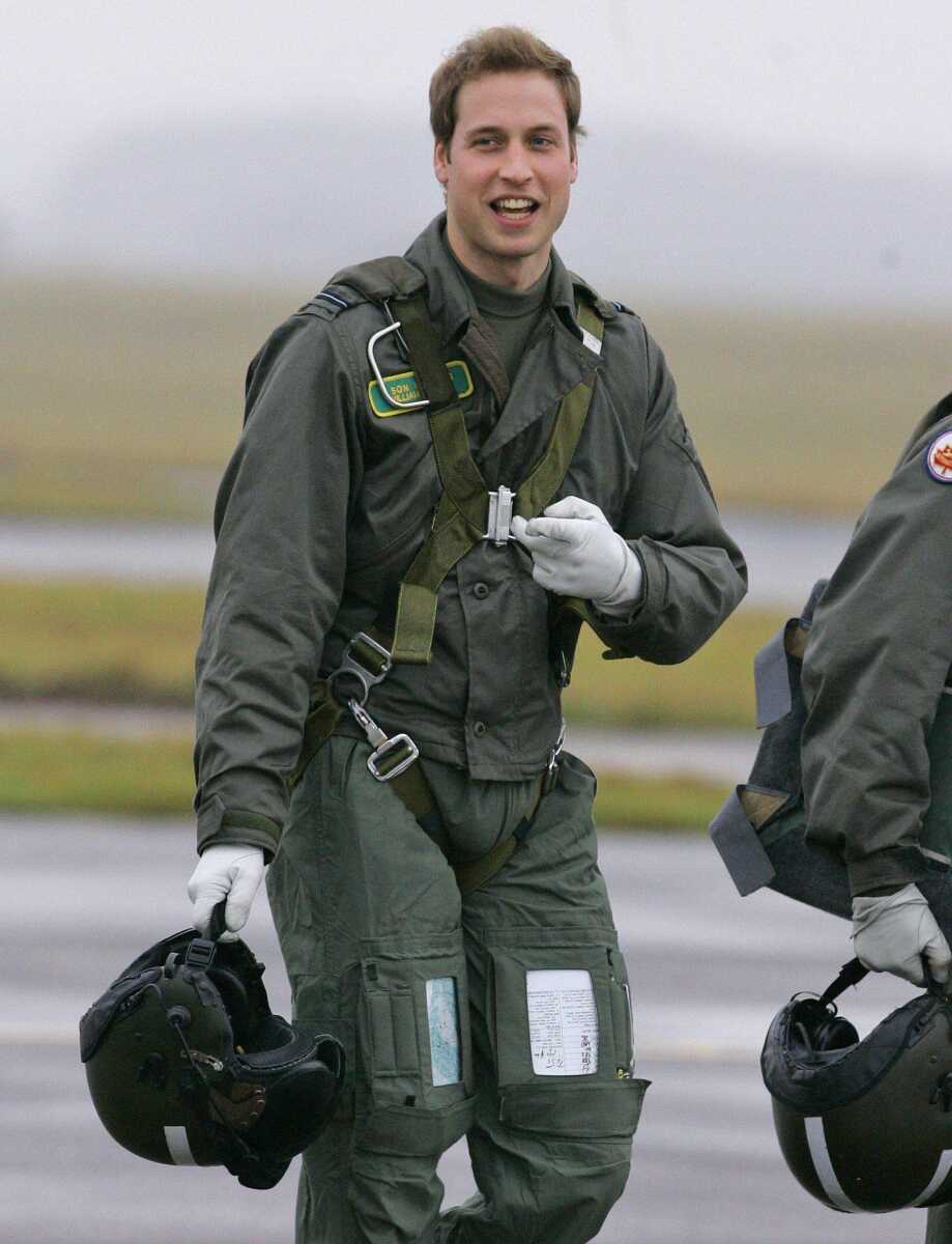 Kirsty Wigglesworth  <br>Associated Press<br>Britain's Prince William gestured Thursday as he walked across the airfield at RAF Cranwell in Lincolnshire, England. The prince, an army officer with the Household Cavalry's Blues and Royals, is two weeks into a four-month attachment with the RAF to help him understand the service's ethos, traditions and military role.