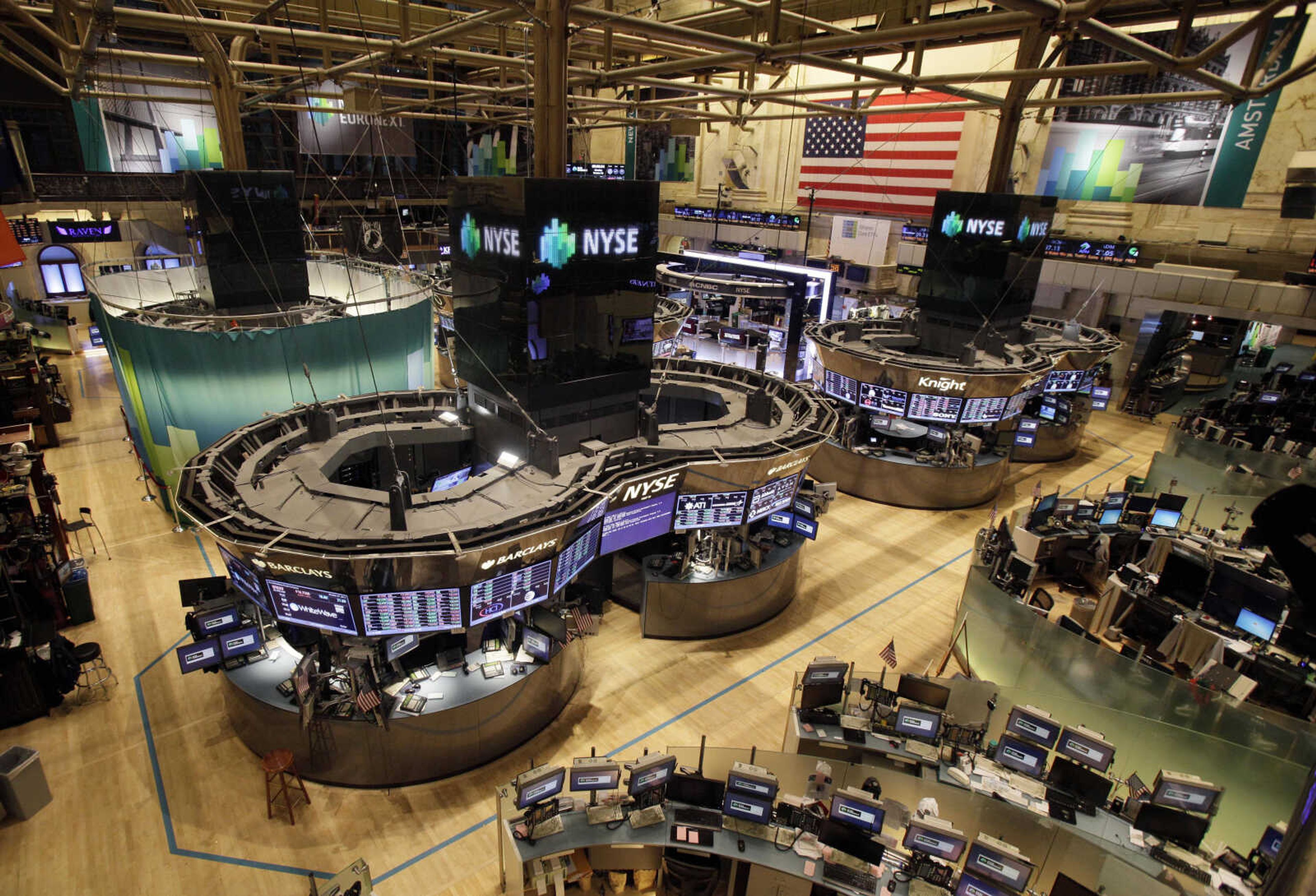 The floor of the New York Stock Exchange is empty of traders, Monday, Oct. 29, 2012, in New York. All major U.S. stock and options exchanges will remain closed Monday with Hurricane Sandy nearing landfall on the East Coast. Trading has rarely stopped for weather. A blizzard led to a late start and an early close on Jan. 8, 1996, according to the exchange's parent company, NYSE Euronext. The NYSE shut down on Sept. 27, 1985 for Hurricane Gloria. (AP Photo/Richard Drew)