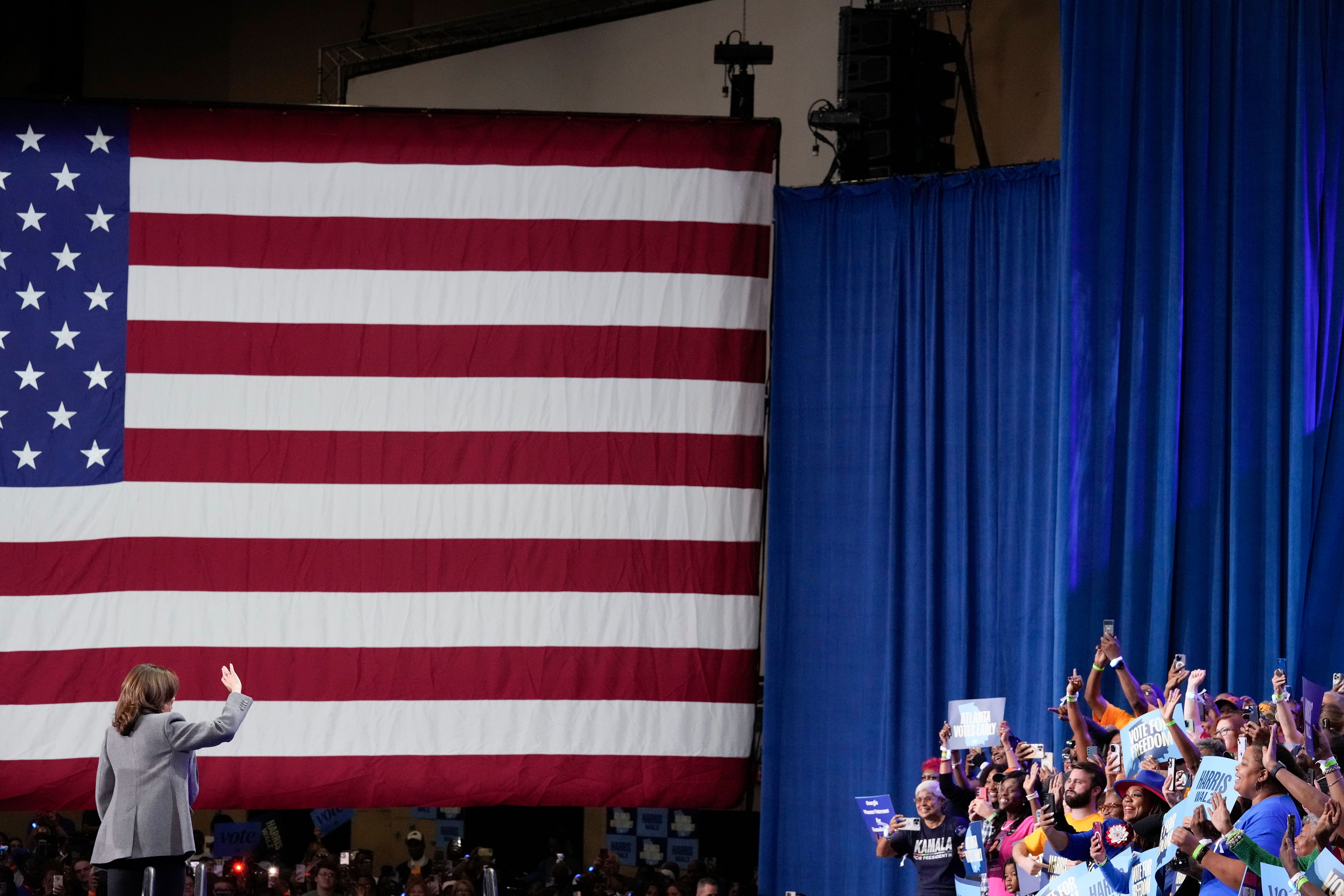 Democratic presidential nominee Vice President Kamala Harris waves to the crowd during a campaign event at Lakewood Amphitheatre, Saturday, Oct. 19, 2024, in Atlanta. (AP Photo/Brynn Anderson)