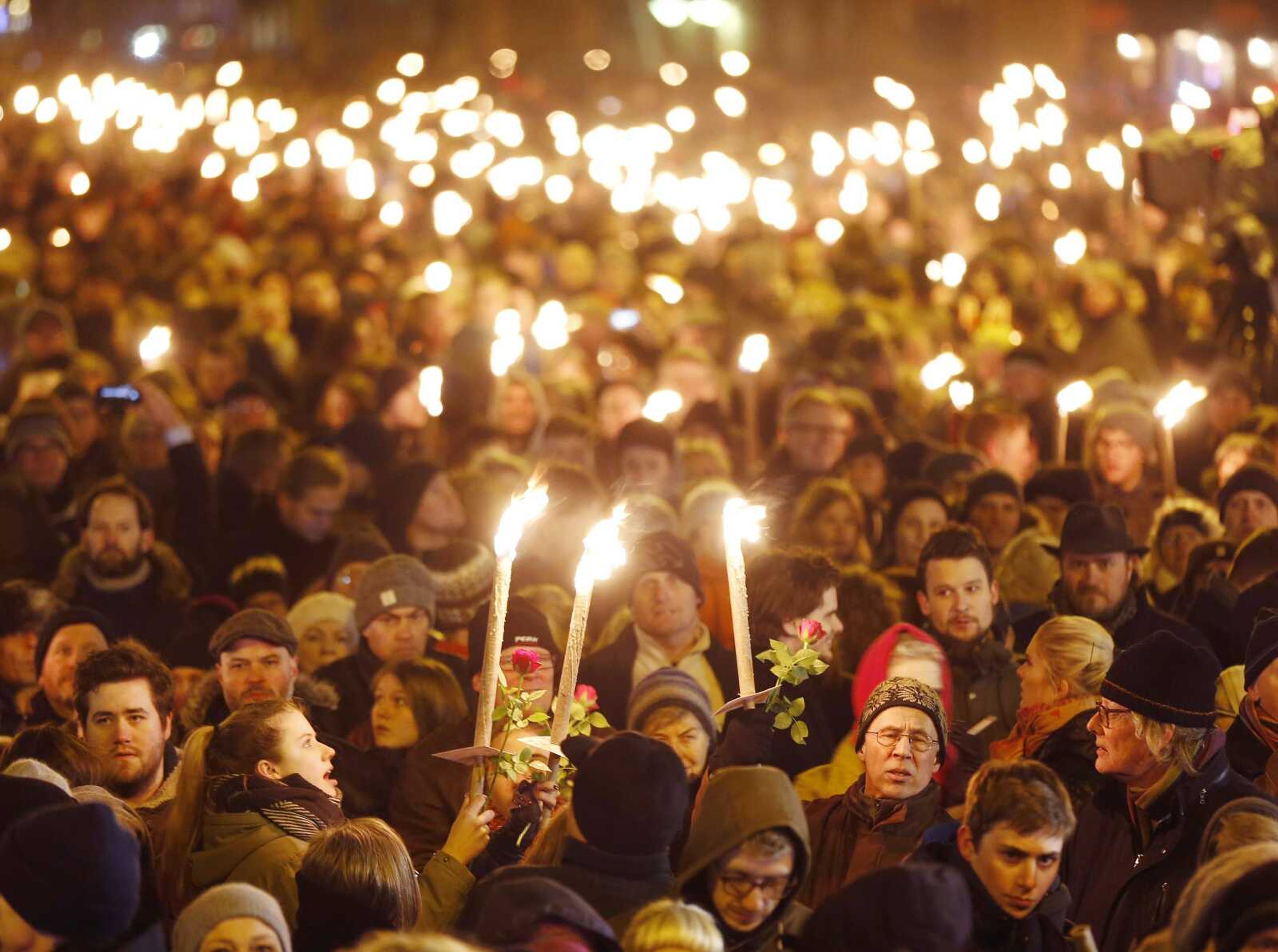 Hundreds of people gather for a vigil Monday near the cultural club in Copenhagen, Denmark. (Michael Probst ~ Associated Press)